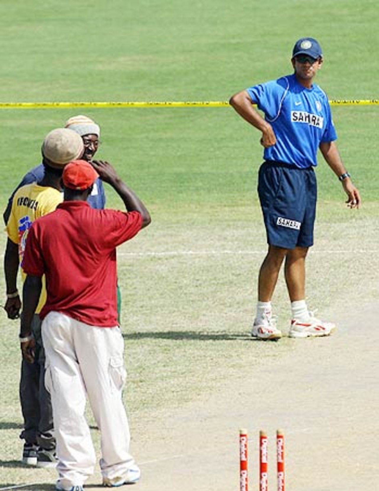 Groundsmen consult Rahul Dravid's opinion on the pitch at Warner Park in Basseterre, St Kitts, May 22, 2006
