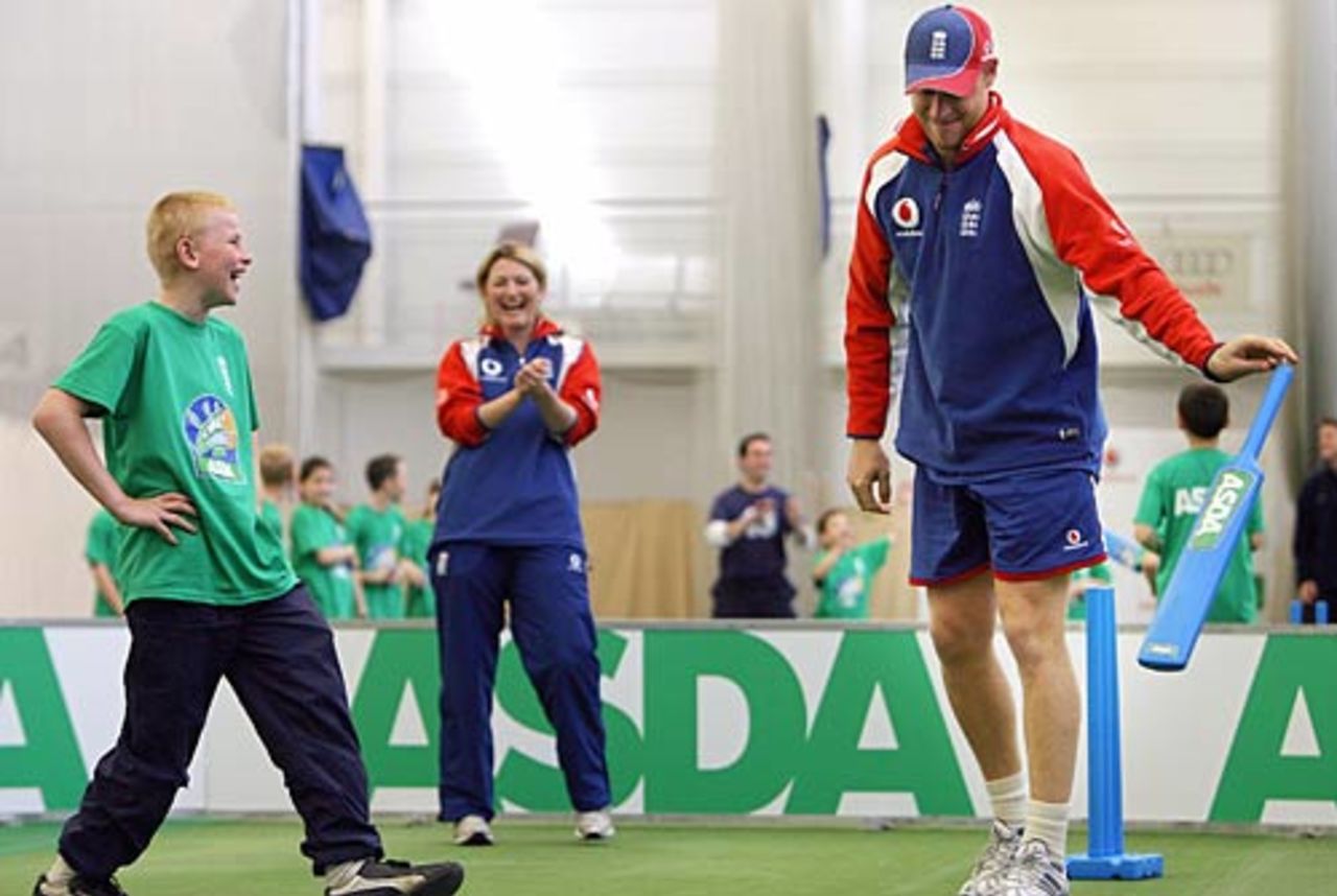 Andrew Flintoff is bowled during the launch of Asda Kwik Cricket to the amusement of a young cricketer, Edgbaston, May 24, 2006