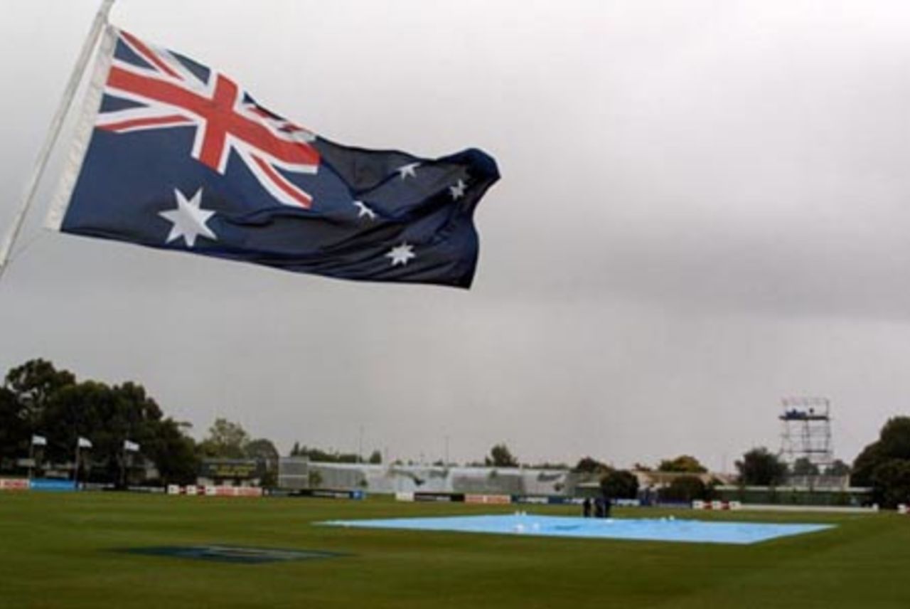 The Australian flag flutters in the strong winds during the rain delay. 2nd ICC Under-19 World Cup Super League Semi Final: Australia Under-19s v West Indies Under-19s at Bert Sutcliffe Oval, Lincoln, 6-7 February 2002 (6 February 2002).