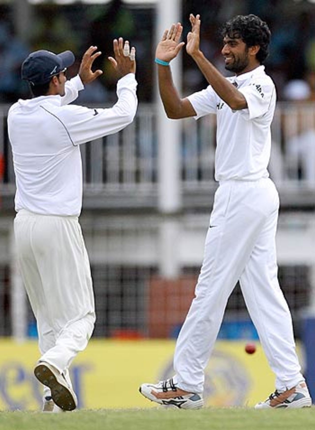 Mohammad Kaif congratulates Munaf Patel after dismissing Denesh Ramdin, 1st Test, Antigua, 3rd day, June 4, 2006
