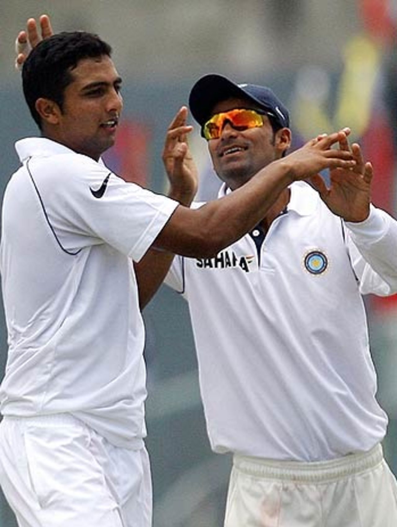 Mohammad Kaif congratulates VRV Singh on his first Test wicket, West Indies v India, 1st Test, Antigua, 3rd day, June 4, 2006