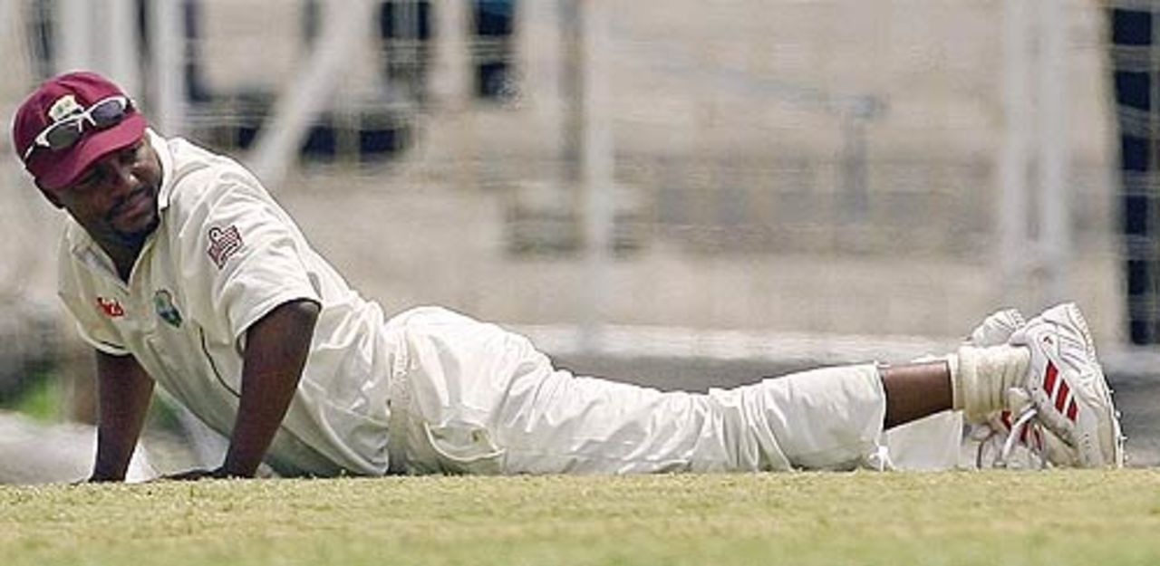Brian Lara takes a tumble after scoring a direct hit, West Indies v India, 1st Test, Antigua, 4th day, June 5, 2006