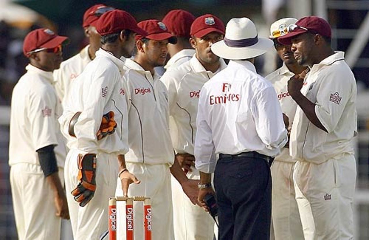 Brian Lara and his team-mates gather to justify the catch at the boundary with the umpire, West Indies v India, 1st Test, Antigua, 4th day, June 5, 2006
