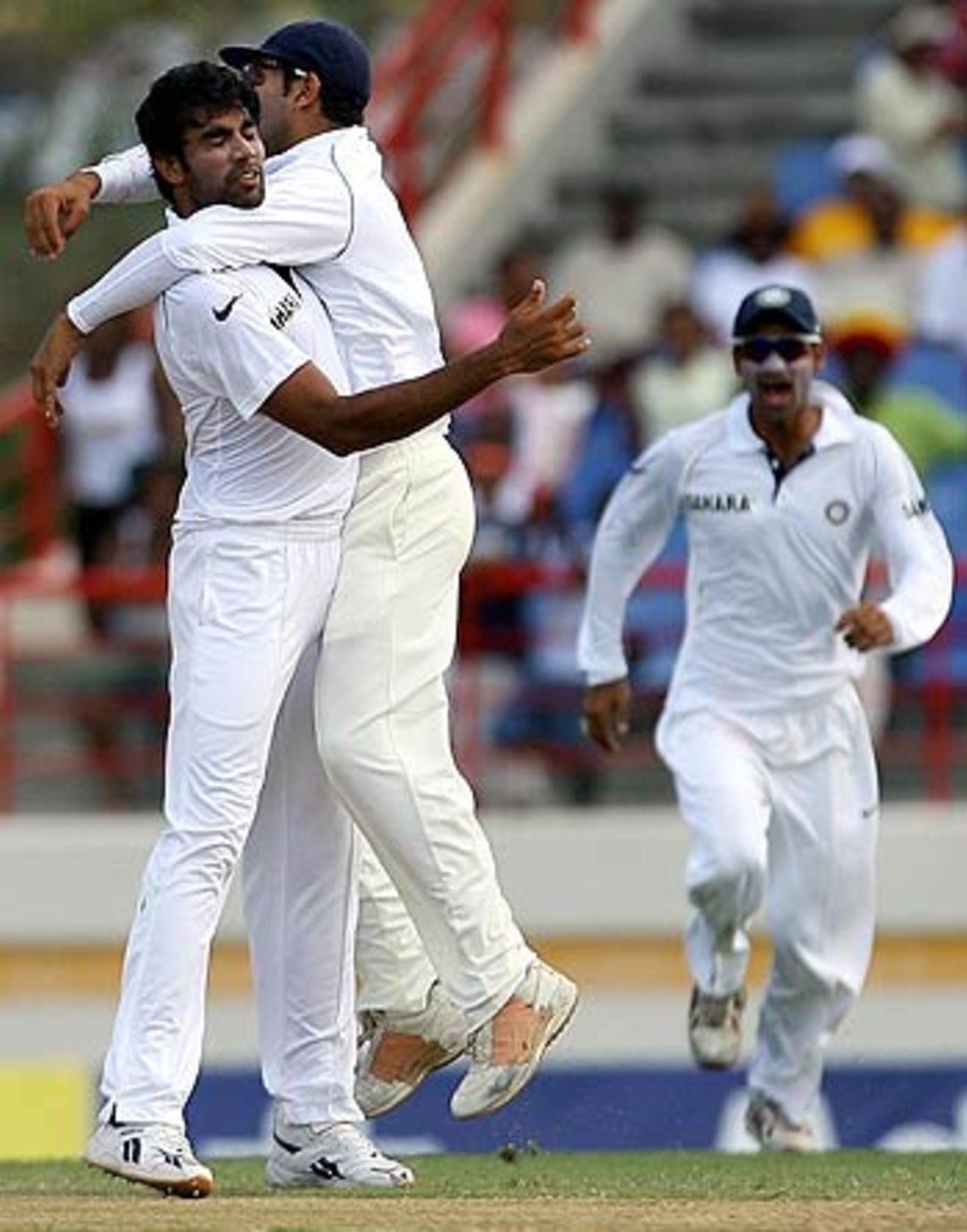 Munaf Patel and Yuvraj Singh celebrate the wicket of Ramnaresh Sarwan , West Indies v India, 2nd Test, St Lucia, 2nd day, June 11, 2006