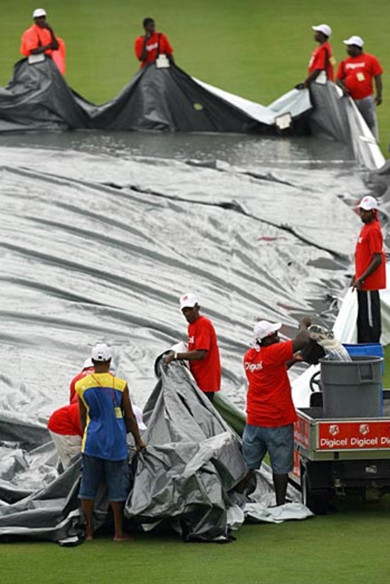 The groundstaff clear water off the covers, West Indies v India, 2nd Test, St Lucia, 4th day, June 13, 2006