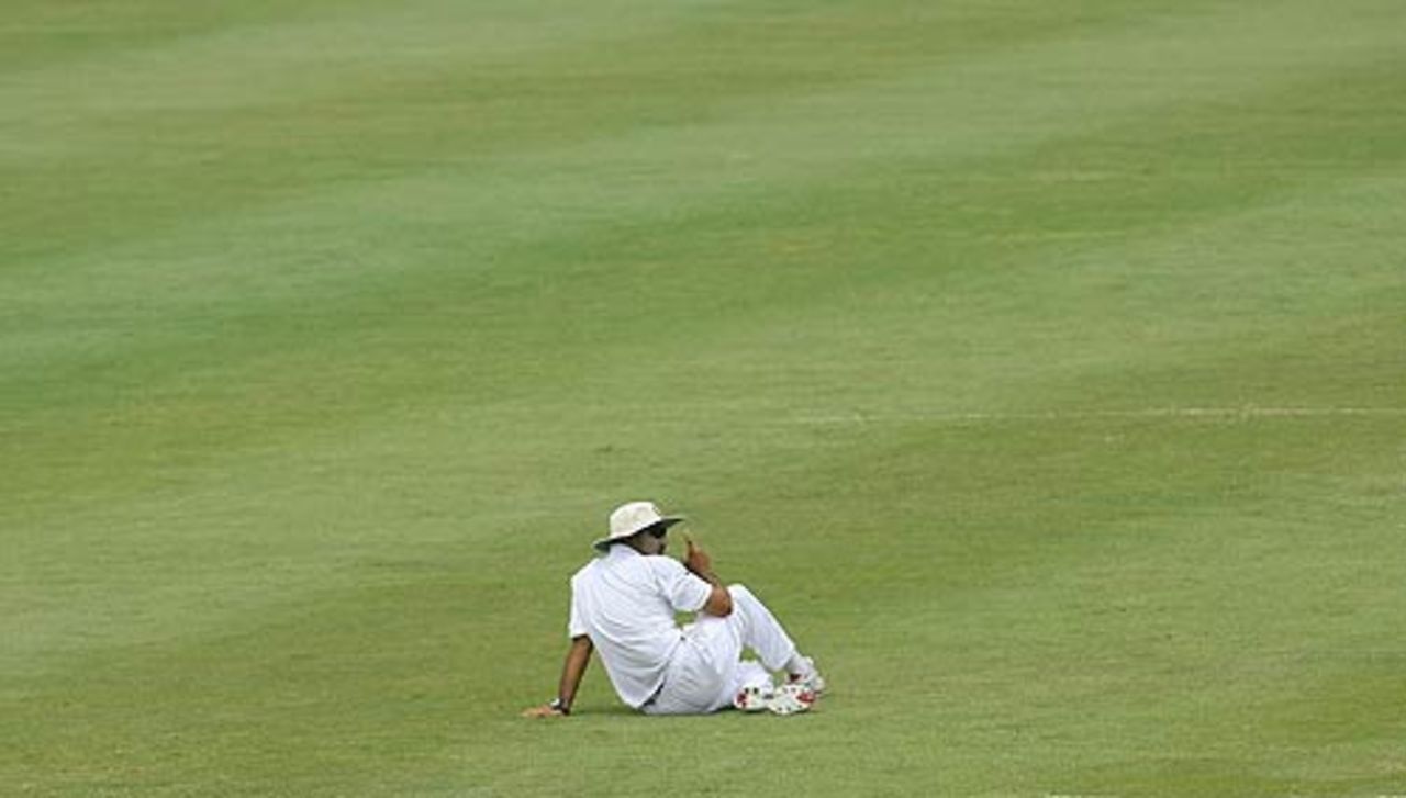 Virender Sehwag sits in solitude in the outfield, West Indies v India, 2nd Test, St Lucia, 5th day, June 14, 2006