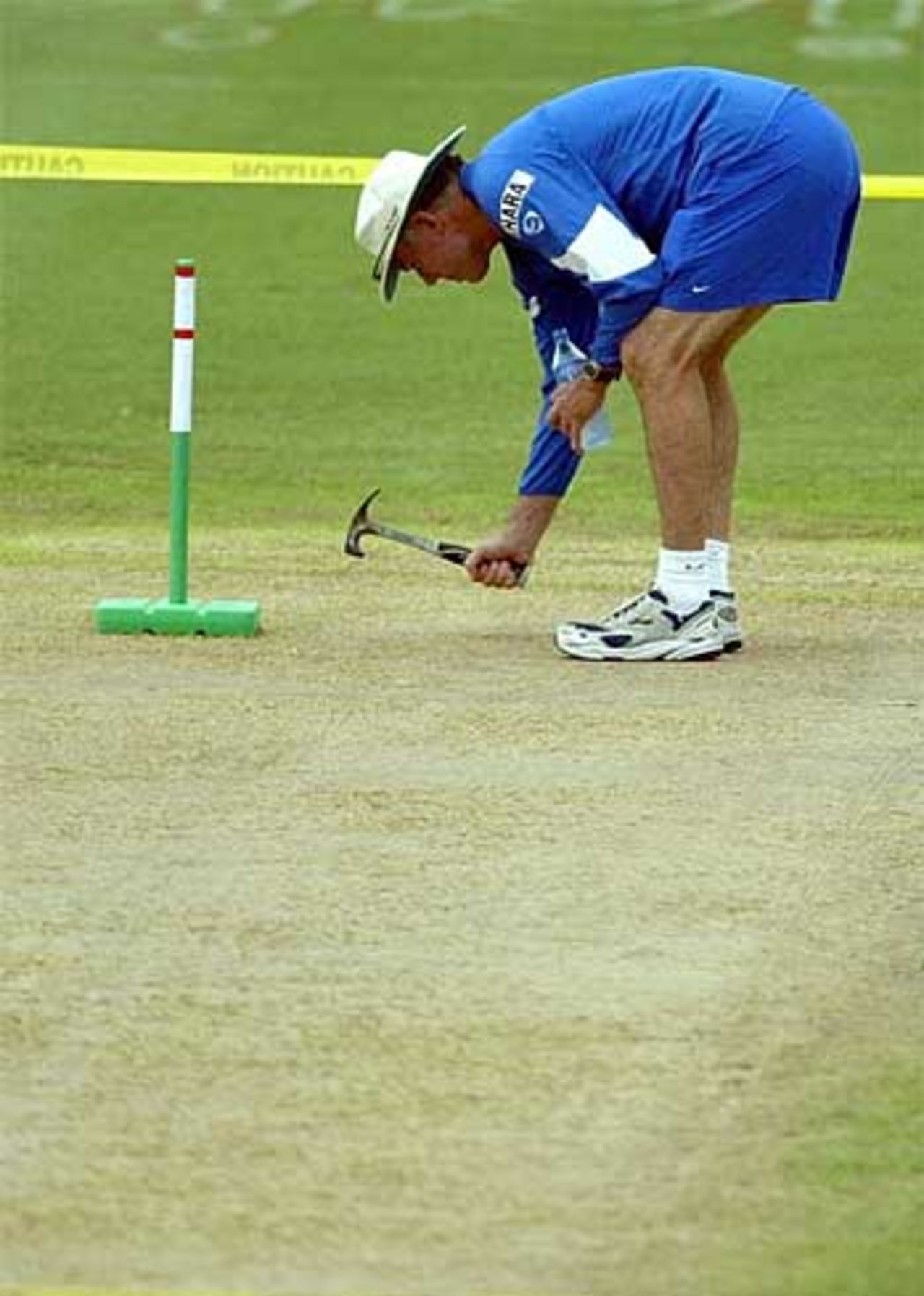 Tapping into success? India's coach Greg Chappell tests the pitch ahead of the third Test against West Indies at St Kitts, India in West Indies, June 21, 2006