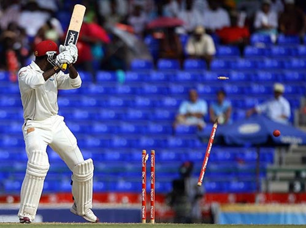 Chris Gayle watches as his off stump takes a walk, West Indies v India, 3rd Test, St Kitts, 1st day, June 22, 2006