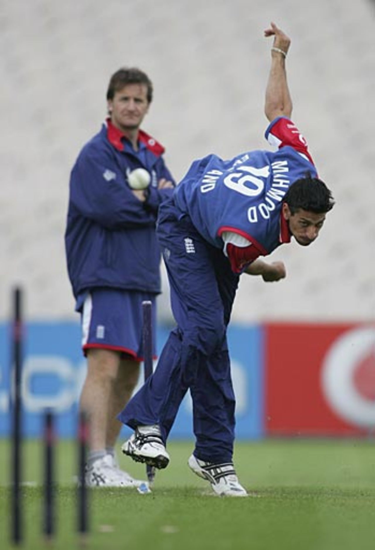 Sajid Mahmood - overseen by bowling coach Kevin Shine - unwinds in the nets at Old Trafford, June 26, 2006