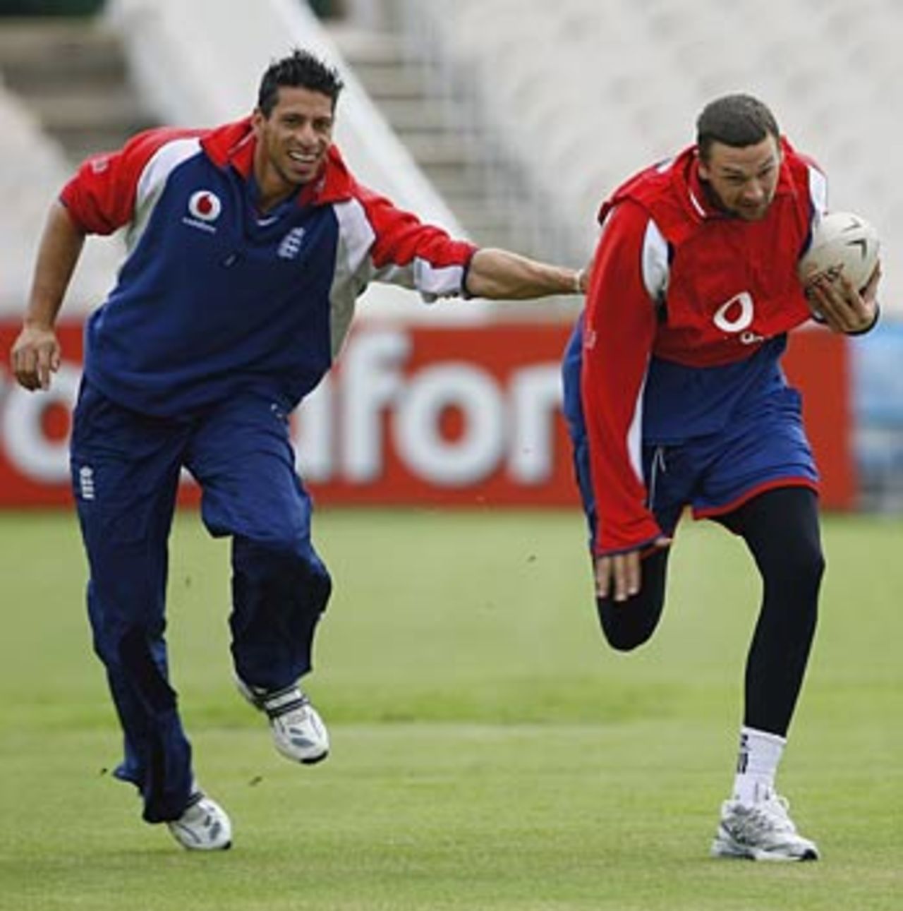 Sajid Mahmood and Steve Harmison have a game of rugby during training, Old Trafford, June 27, 2006
