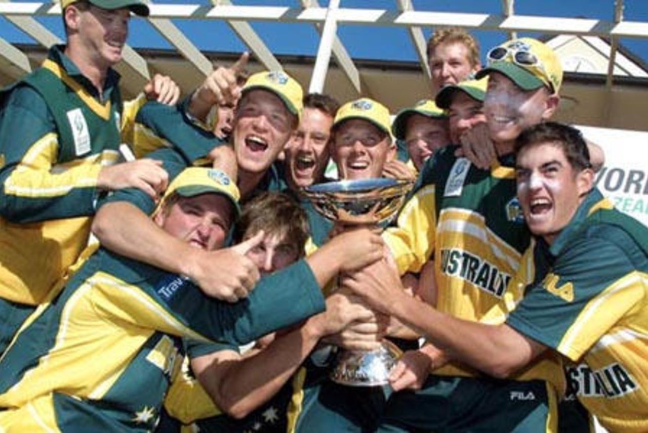 Australia Under-19 players celebrate with the ICC Under-19 World Cup trophy. ICC Under-19 World Cup Super League Final: Australia Under-19s v South Africa Under-19s at Bert Sutcliffe Oval, Lincoln, 9 February 2002.