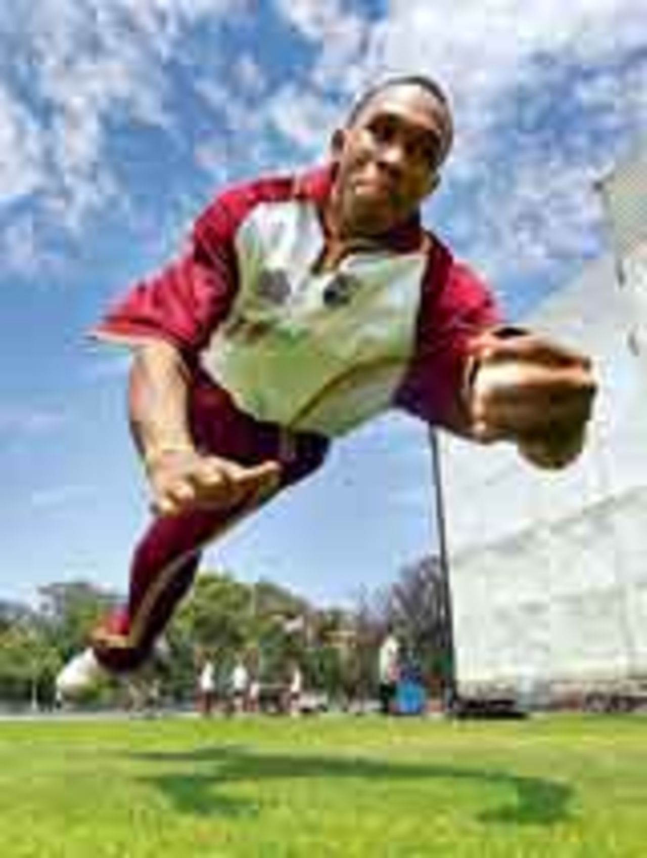 West Indies allrounder Dwayne Bravo dives during a training session