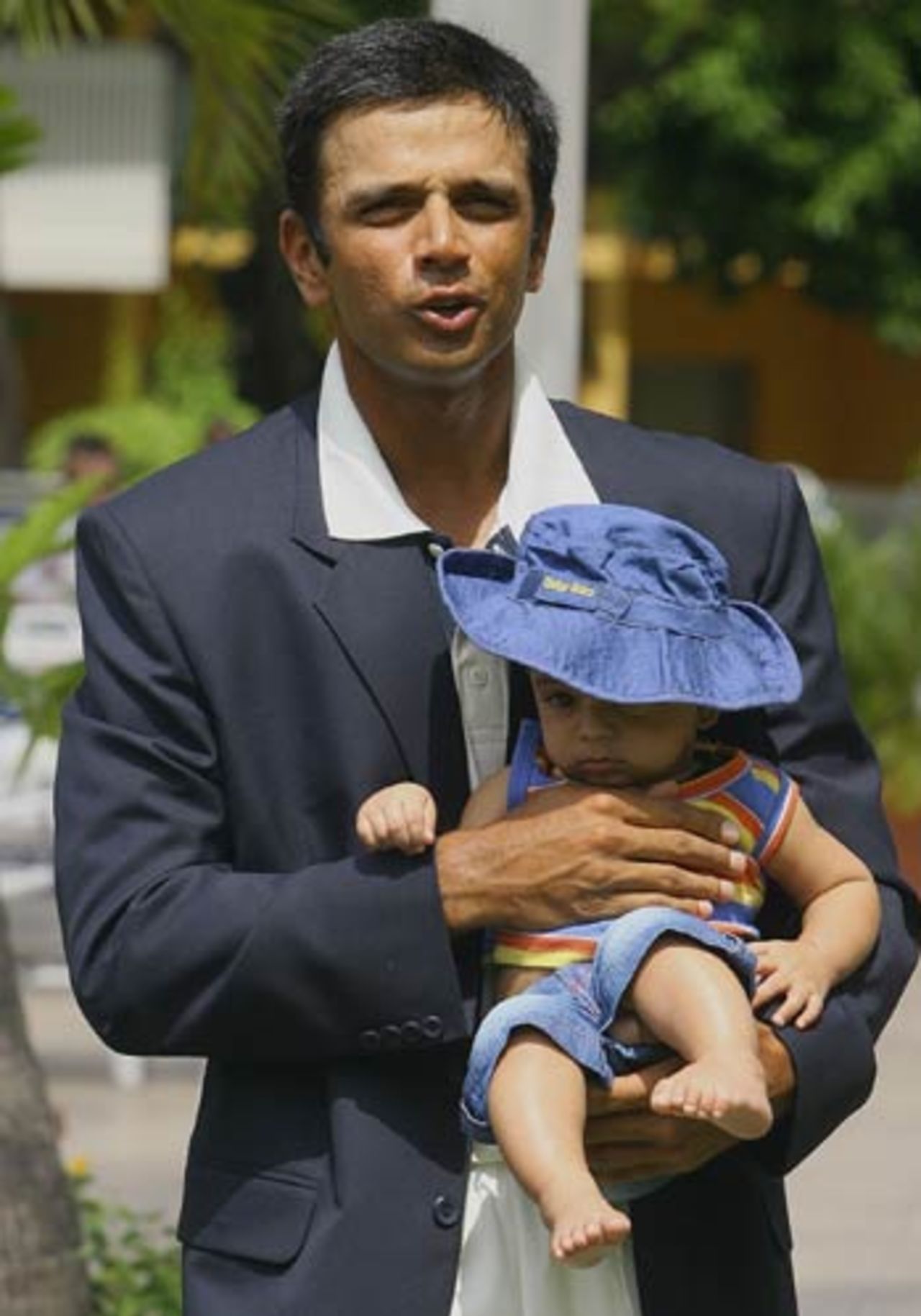 Rahul Dravid poses with his son Samit after India clinched a rare series win outside the subcontinent, in West Indies, July 3, 2006