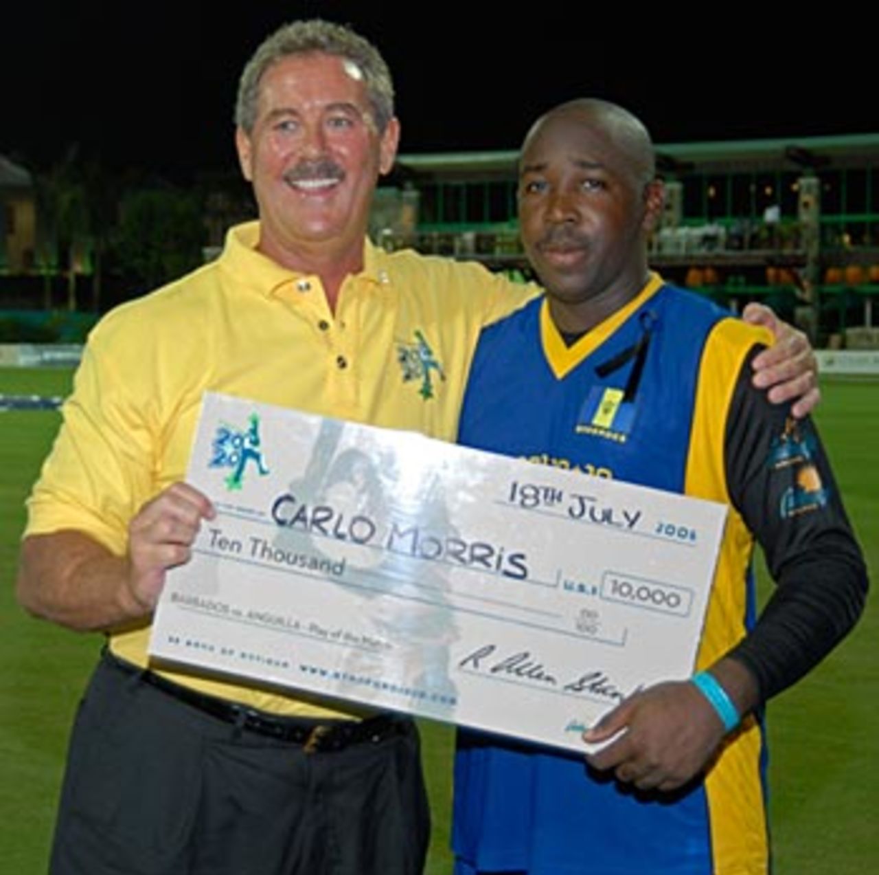 Allen Stanford hands Carlo Morris a cheque for $10,000, Anguilla v Barbados, Stanford 20/20, Antigua, July 18, 2006
