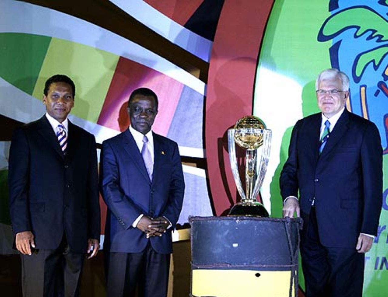 Malcolm Speed, Chris Dehring, the Cricket World Cup chief executive, and Keith Mitchell, the prime minister of Grenada, pose with the World Cup 2007 trophy , New Delhi, July 27, 2006