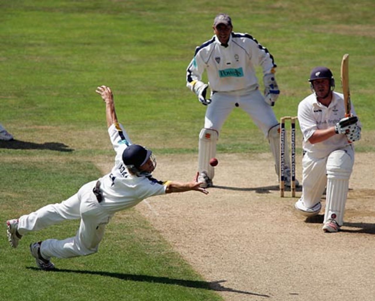 Jimmy Adams unsuccessfully dives to catch Anthony McGrath, Hampshire v  Yorkshire, Southampton, July 28, 2006