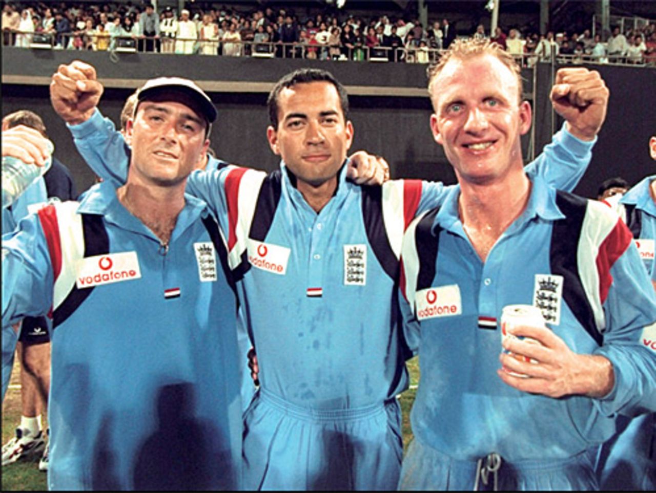 Graham Thorpe, Adam Hollioake and Matthew Fleming celebrate England's victory at Sharjah