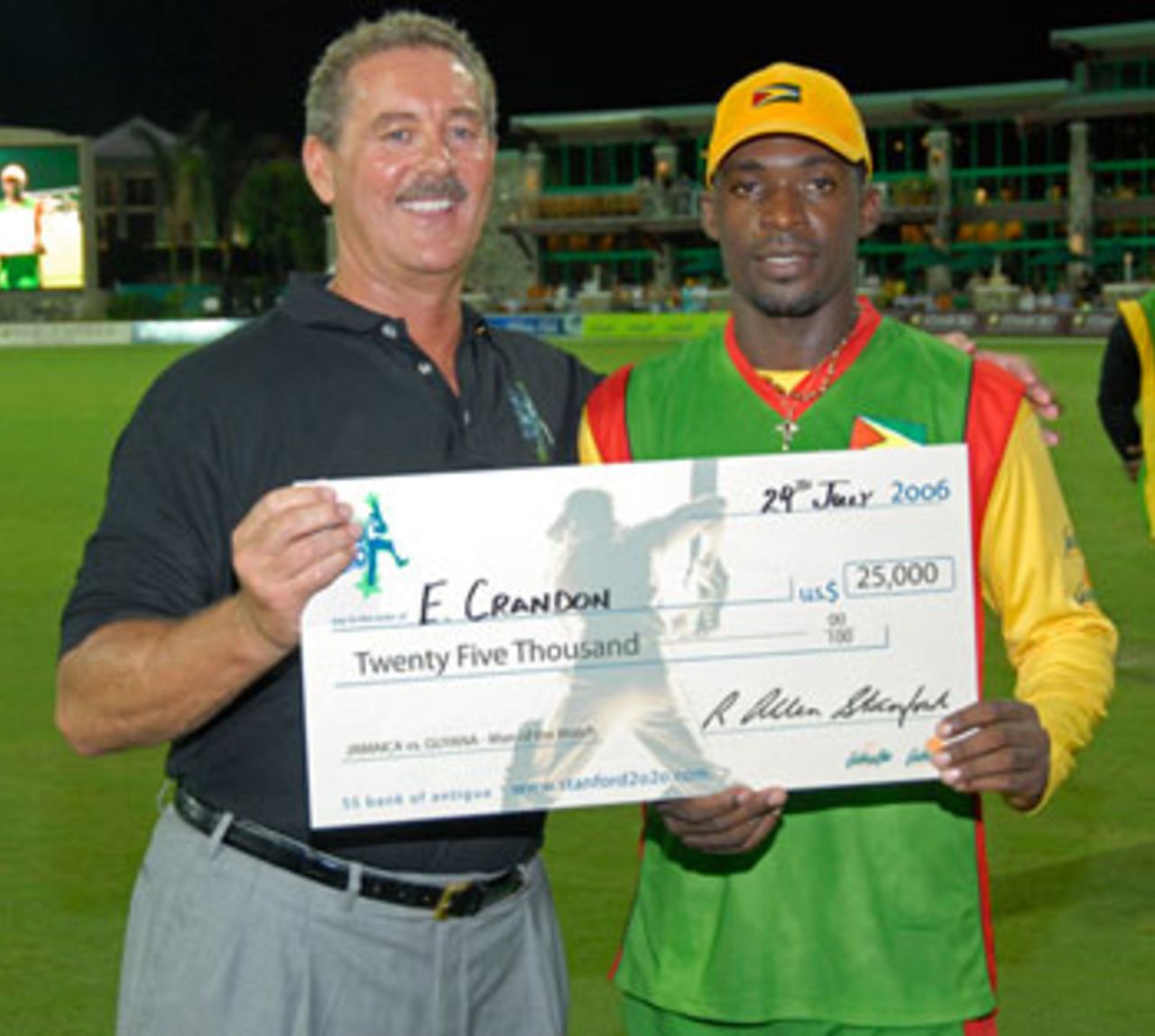 Man of the Match Esuan Crandon collects his $25,000 cheque from Allen Stanford, Guyana v Jamaica, Stanford 20/20, July 29, 2006 	