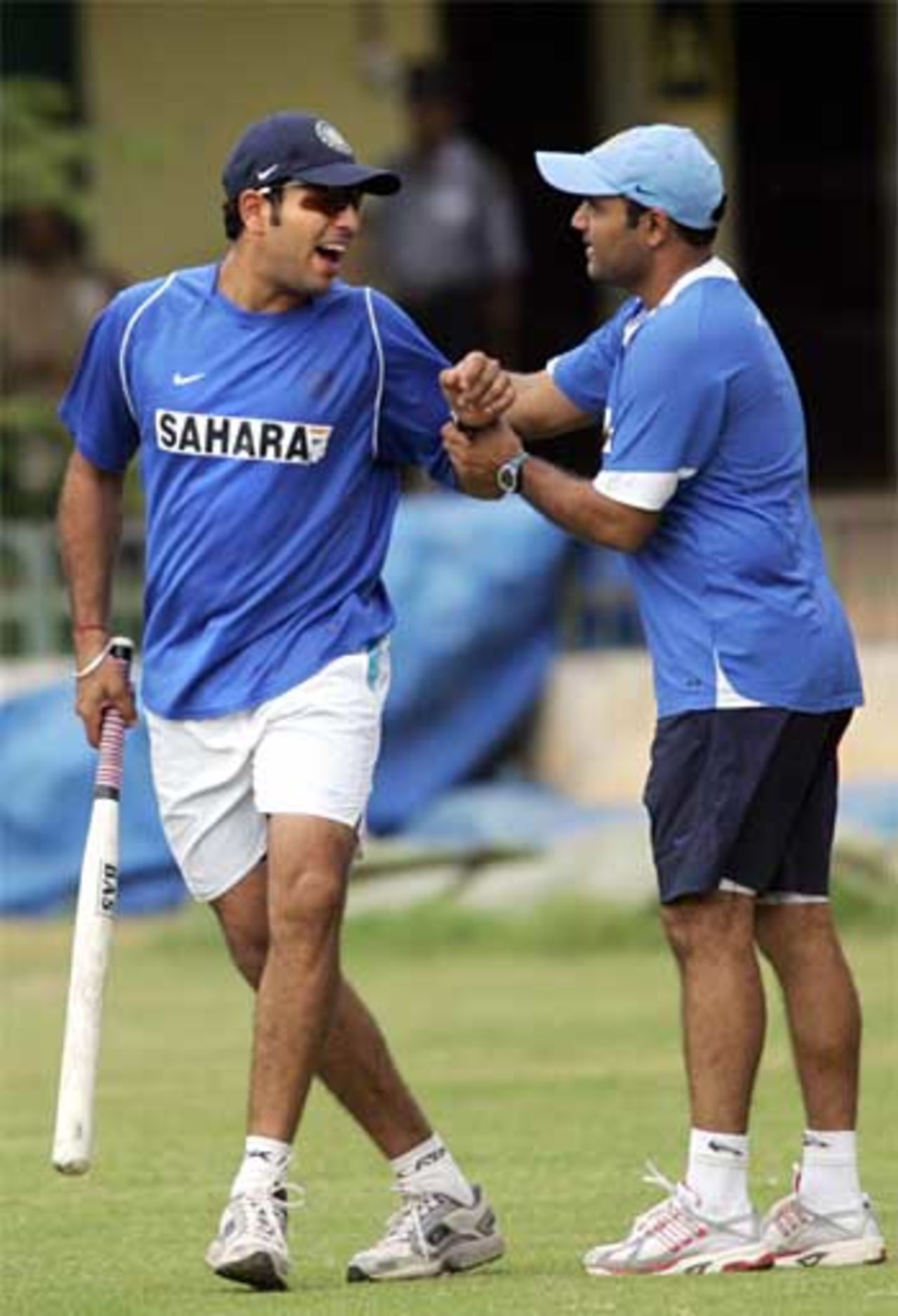 Yuvraj Singh and Virender Sehwag share a joke during India's practice in a ten-day training camp ahead of the tri-series with Sri Lanka and South Africa
