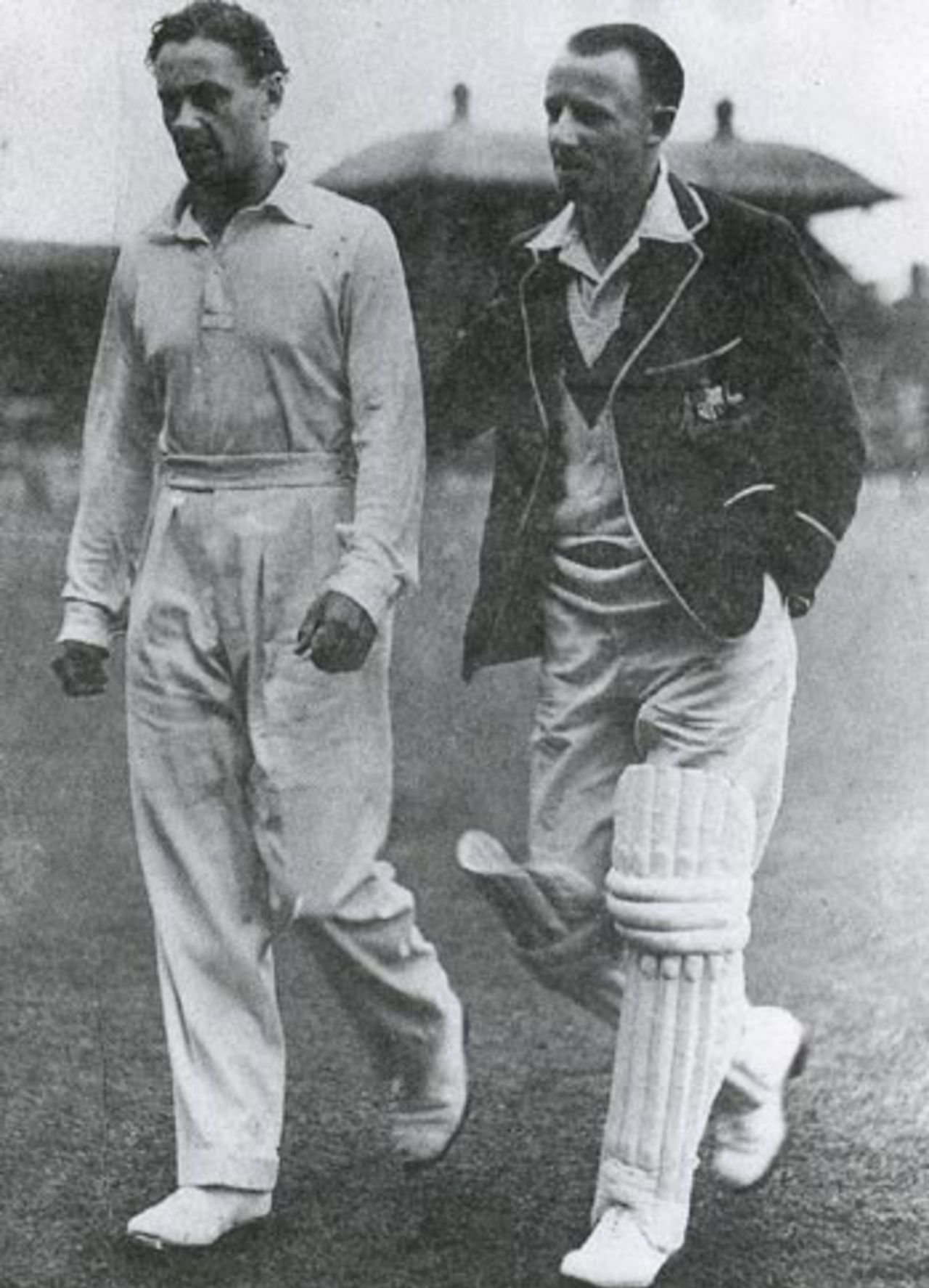 Gubby Allen and Don Bradman return to the pavilion during a rain delay, Australia v England, Melbourne, January 1937