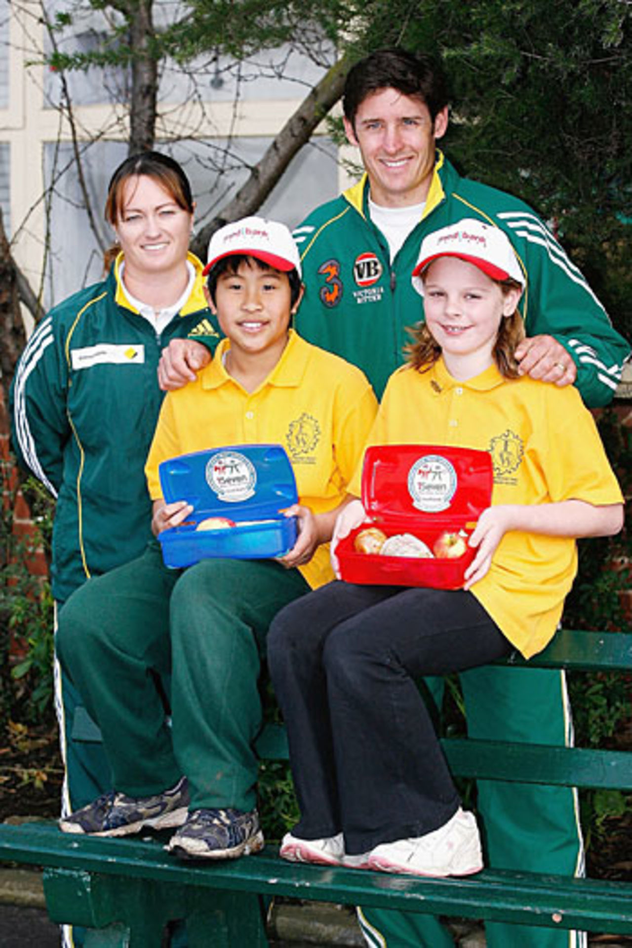 Karen Rolton and Mike Hussey pose with students during the 1Seven media launch, Footscray West Primary School, Melbourne, August 1, 2006