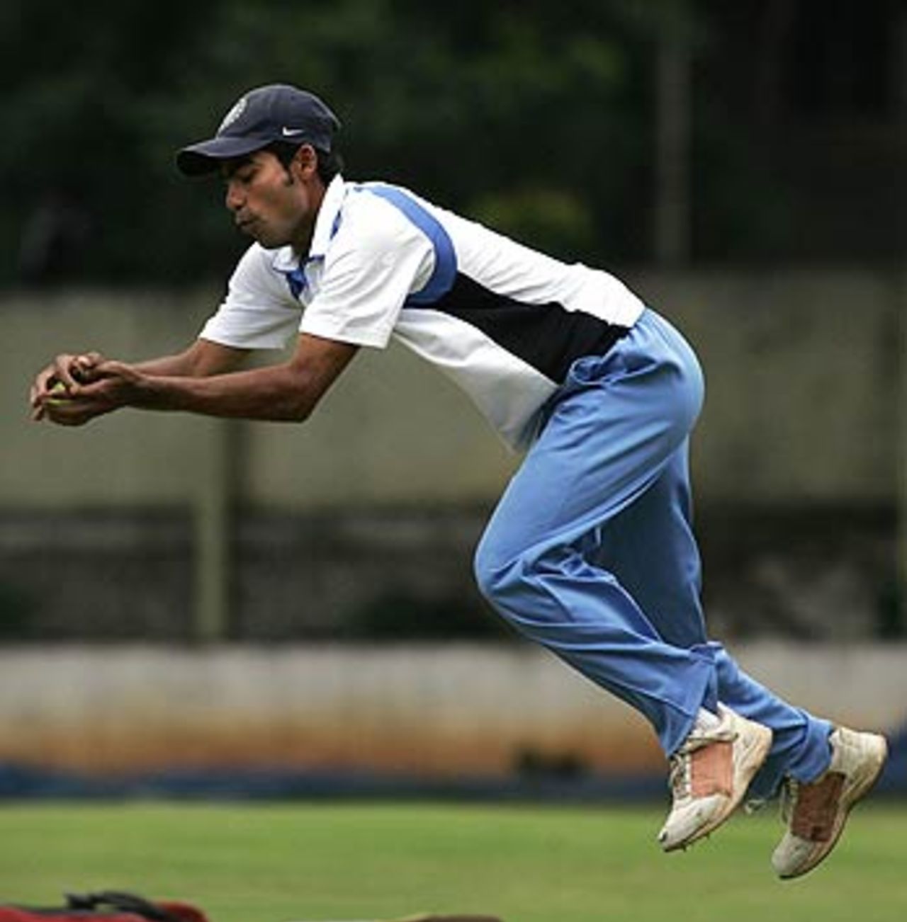 Mohammad Kaif goes through his fielding drills at the National Cricket Academy, Bangalore, August 1, 2006