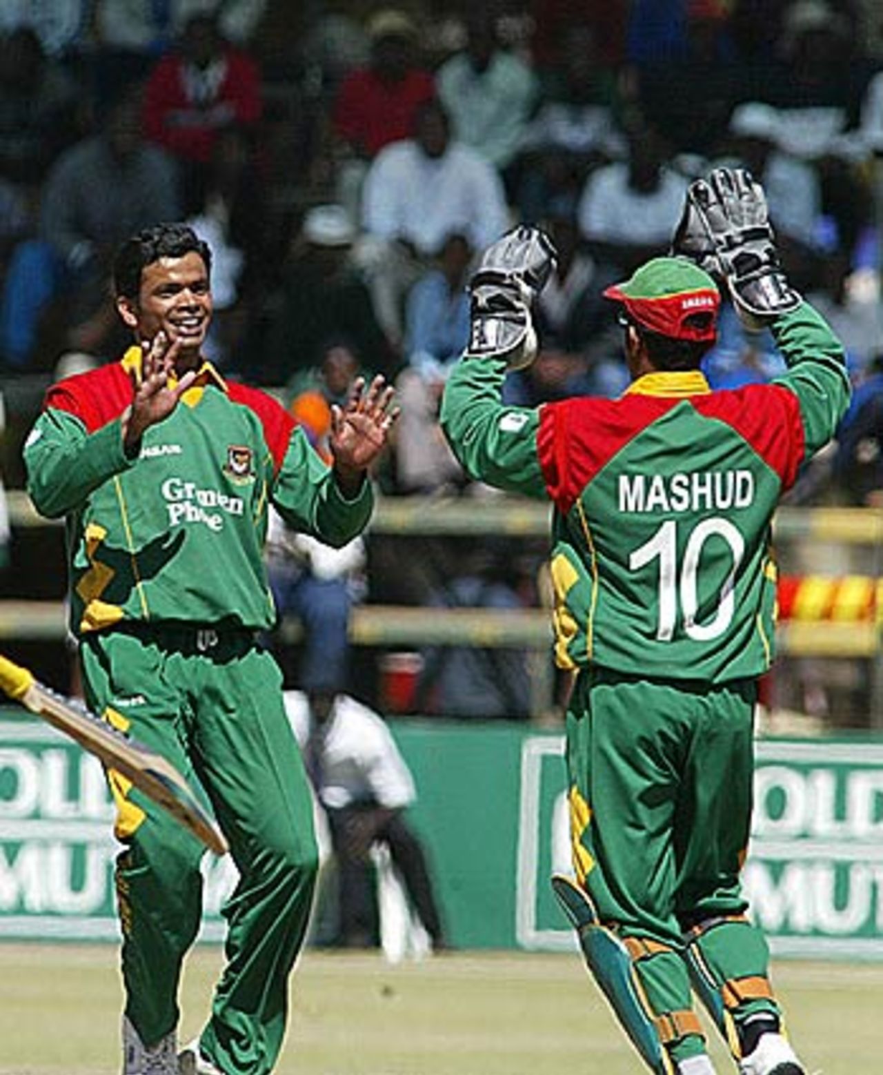 Abdur Razzak and Khaled Mashud celebrate a strike, Zimbabwe v Bangladesh, 5th ODI, Harare, August 6, 2006