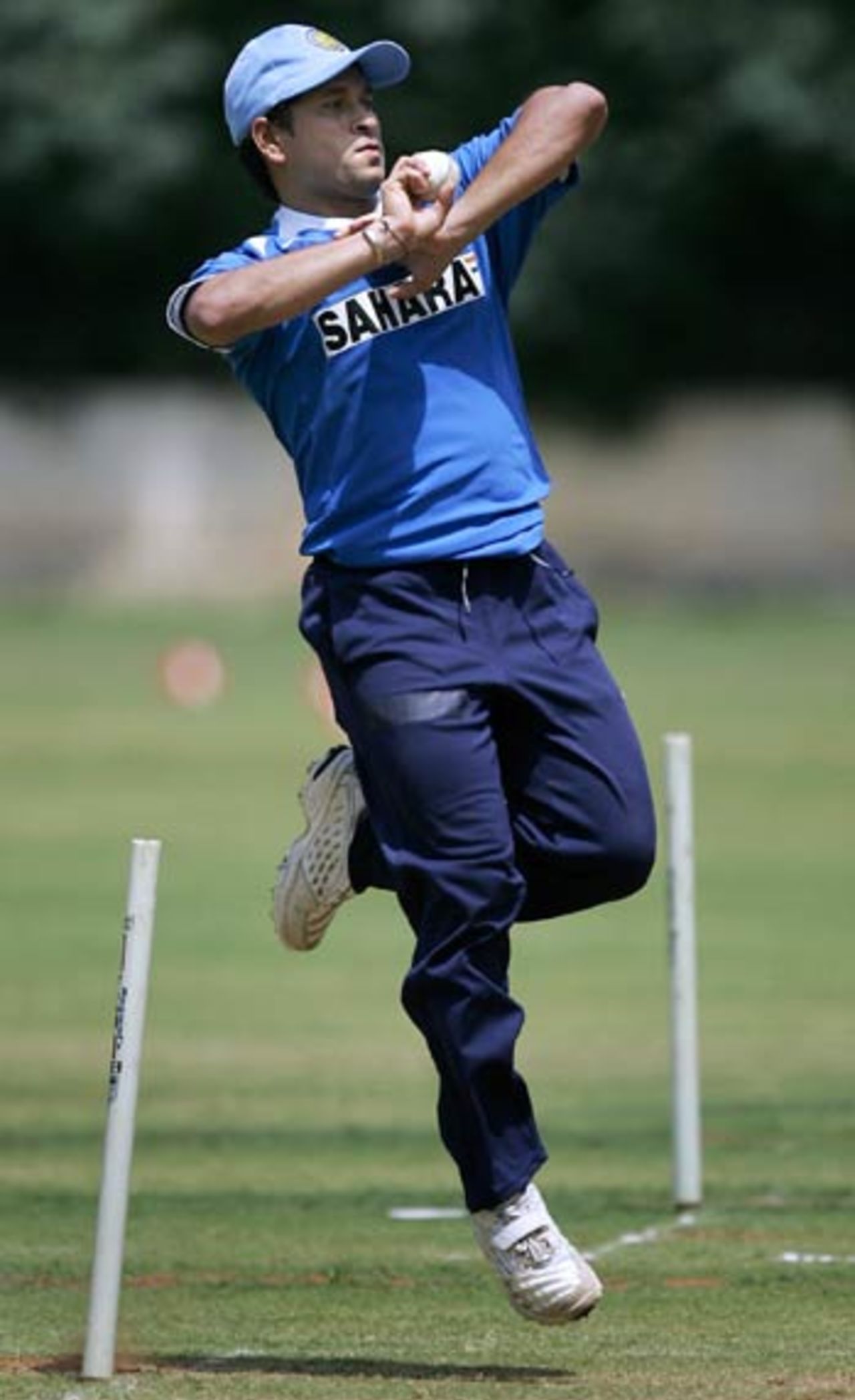 Sachin Tendulkar, who has just recovered from a shoulder surgery, bowls in practice, Bangalore, August 7, 2006
