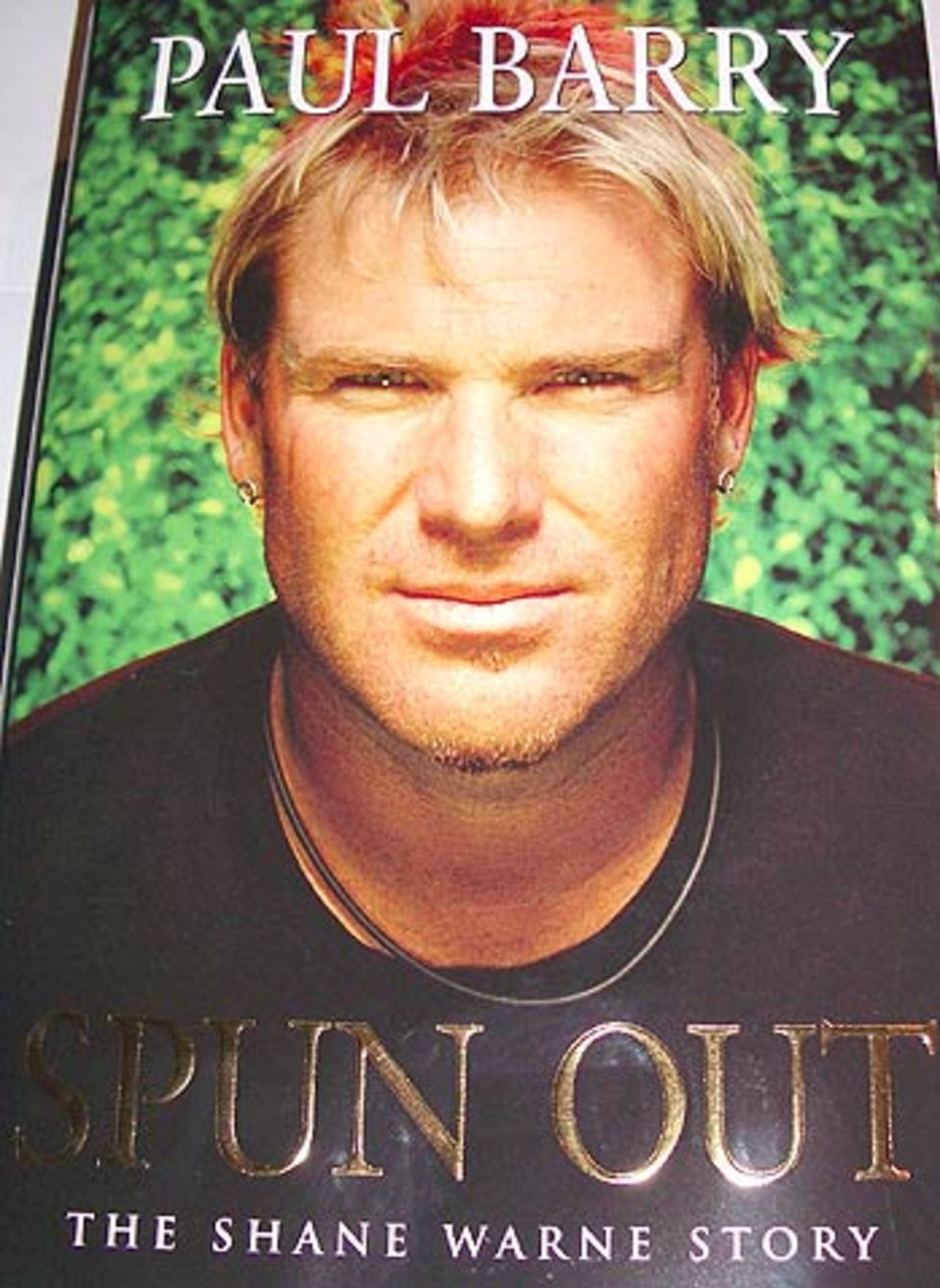 The cover of Shane Warne's biography <i>Spun out</i> written by Paul Barry