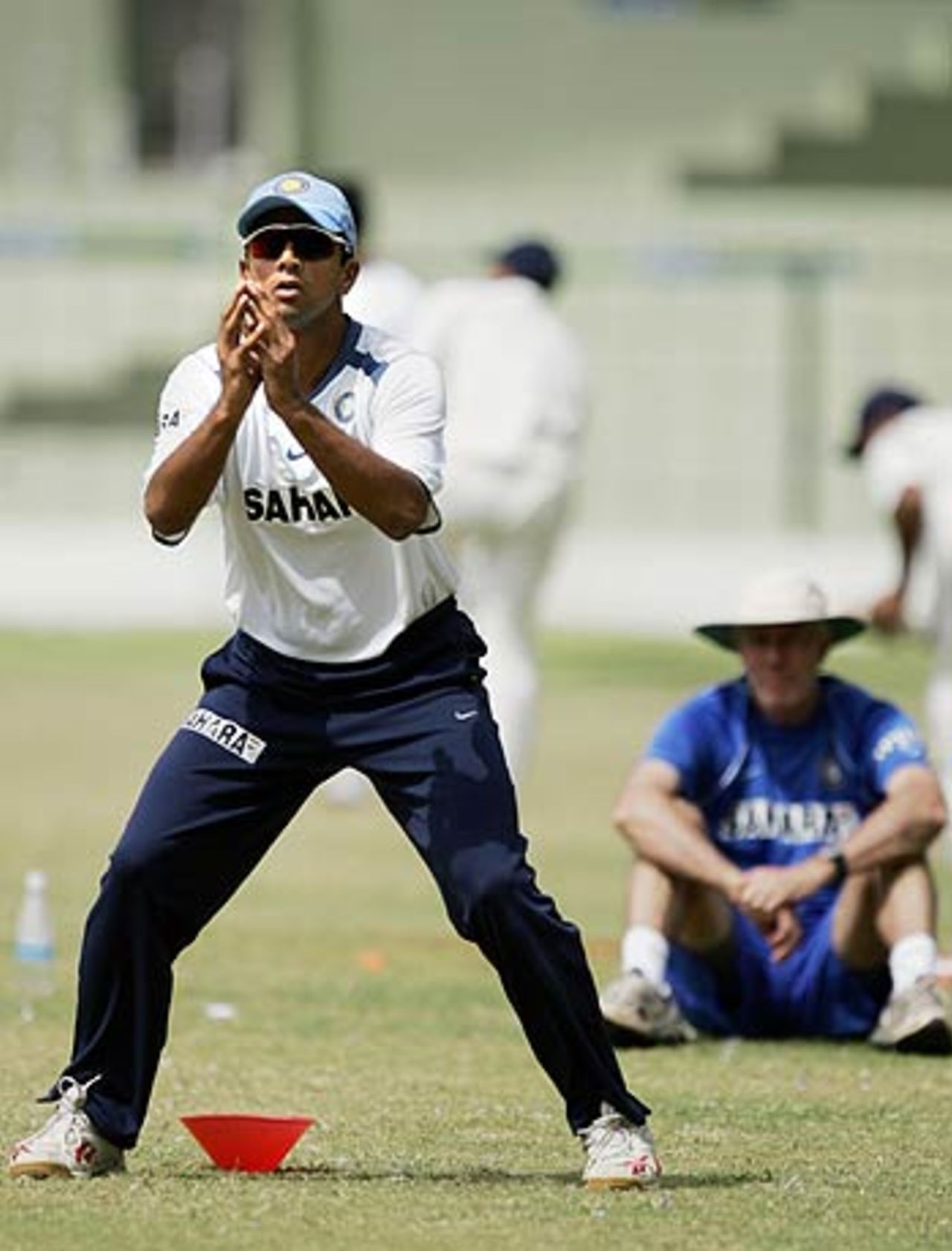 Rahul Dravid gets ready to take a catch as Greg Chappell looks on, National Cricket Academy, Bangalore, August 8, 2006