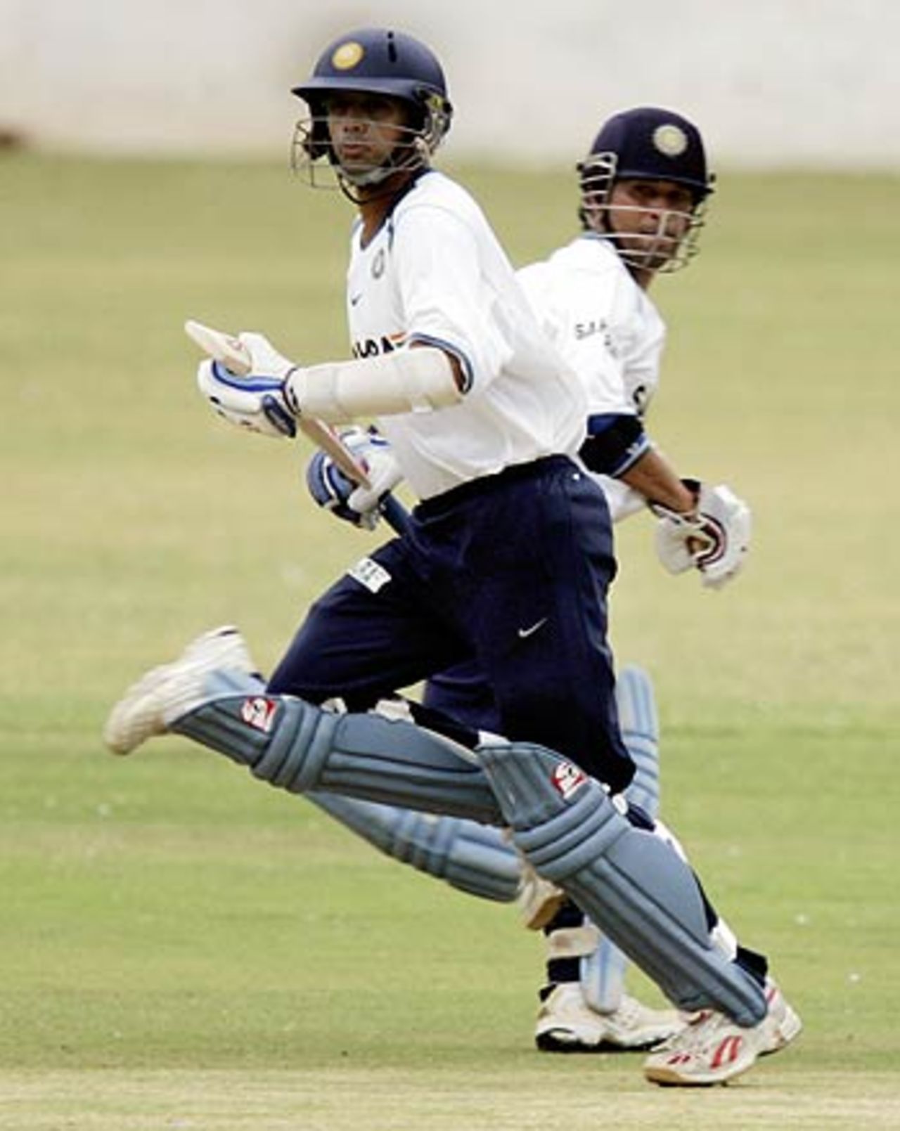 Rahul Dravid and Sachin Tendulkar meet mid-pitch, National Cricket Academy, Bangalore, August 8, 2006