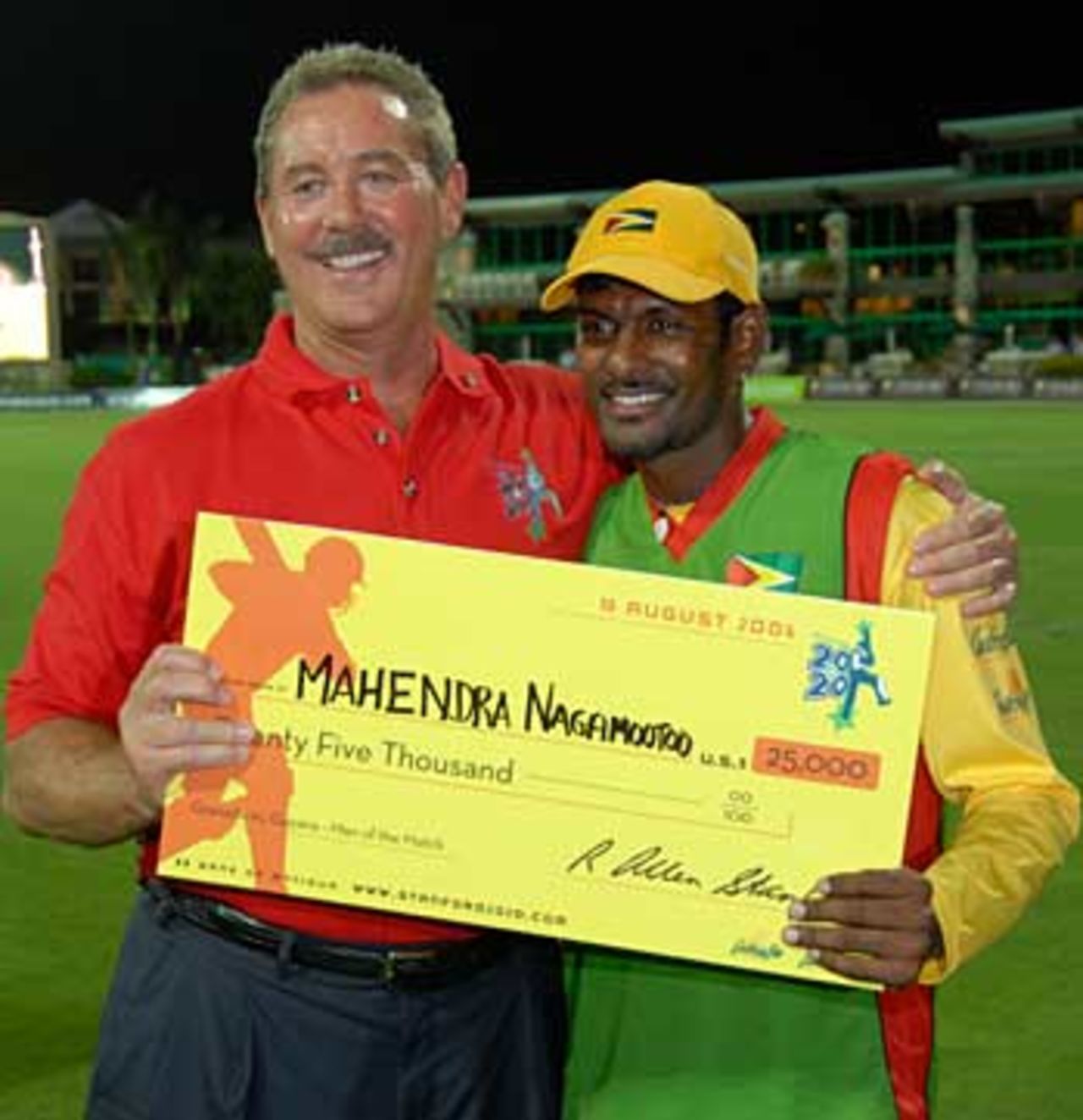 In the money... Mahendra Nagamootoo accepts the Man of the Match award cheque from Allen Stanford, Grenada v Guyana, Stanford 20/20, 1st semi-final, 10 August 2006

