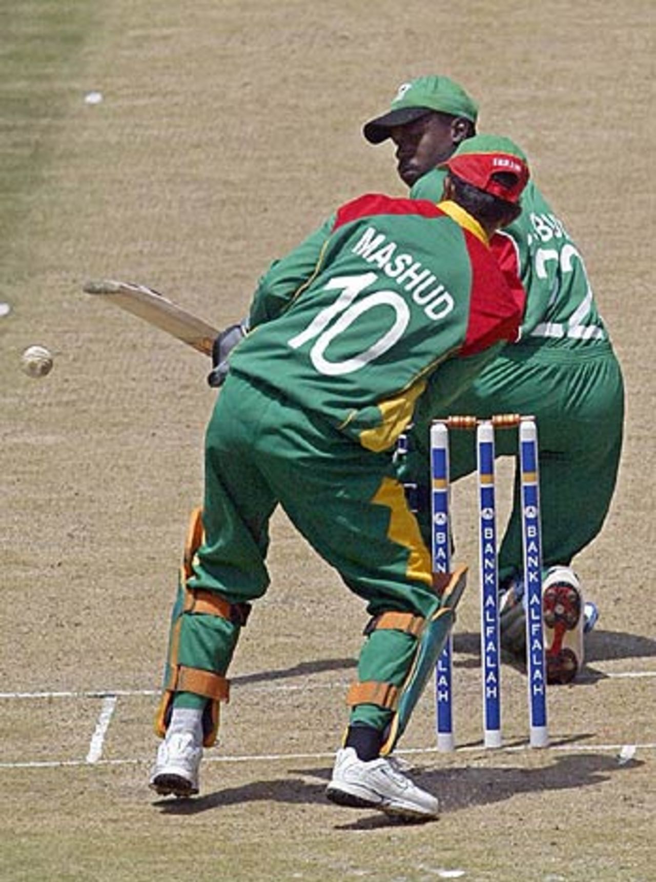 Collins Obuya laps one past Khaled Mashud, Kenya v Bangladesh, 1st ODI, Nairobi, August 12, 2006