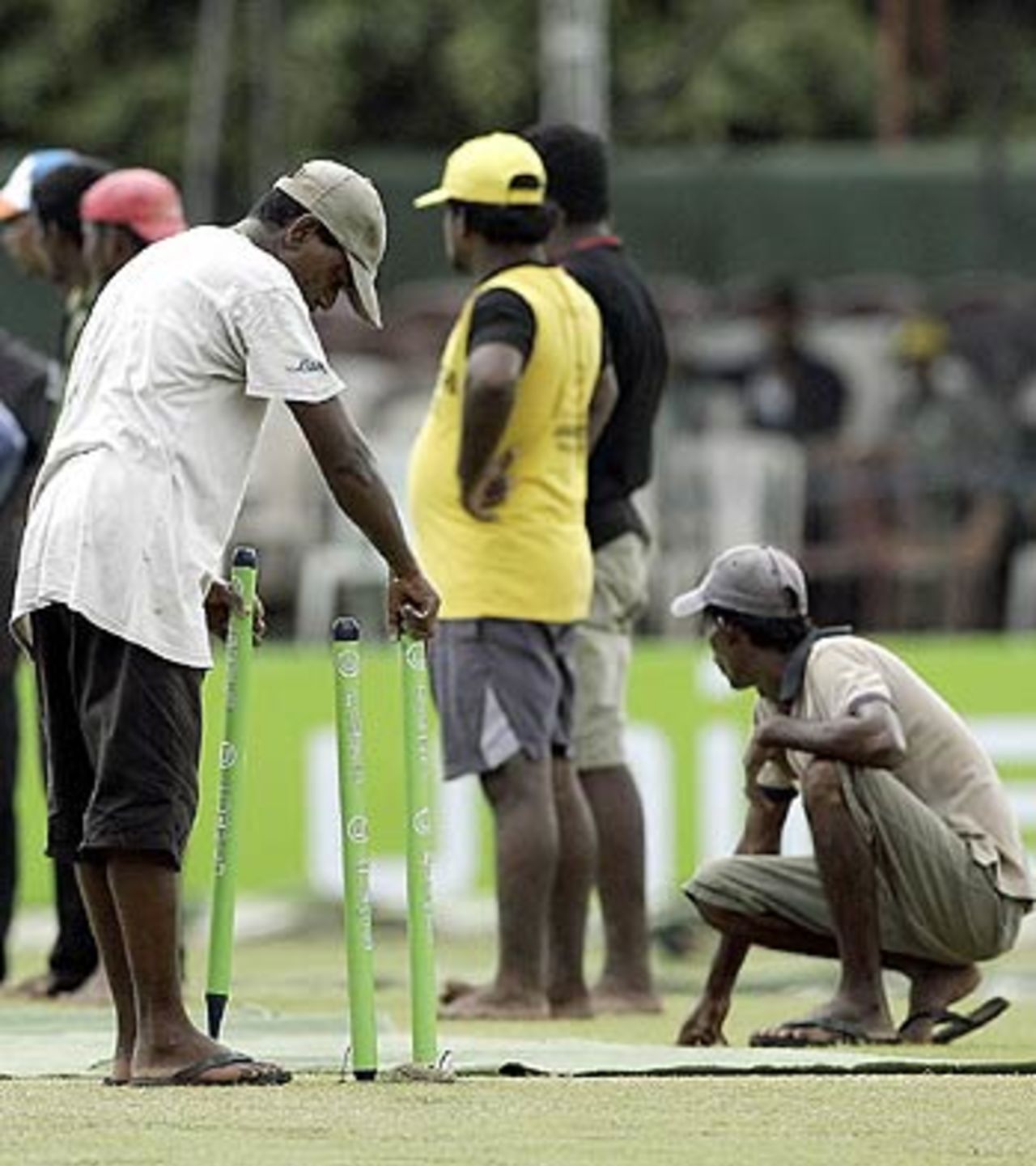 Groundsmen toil to get the pitch and the outfield ready, Sri Lanka v India, 1st ODI, Colombo, August 18, 2006