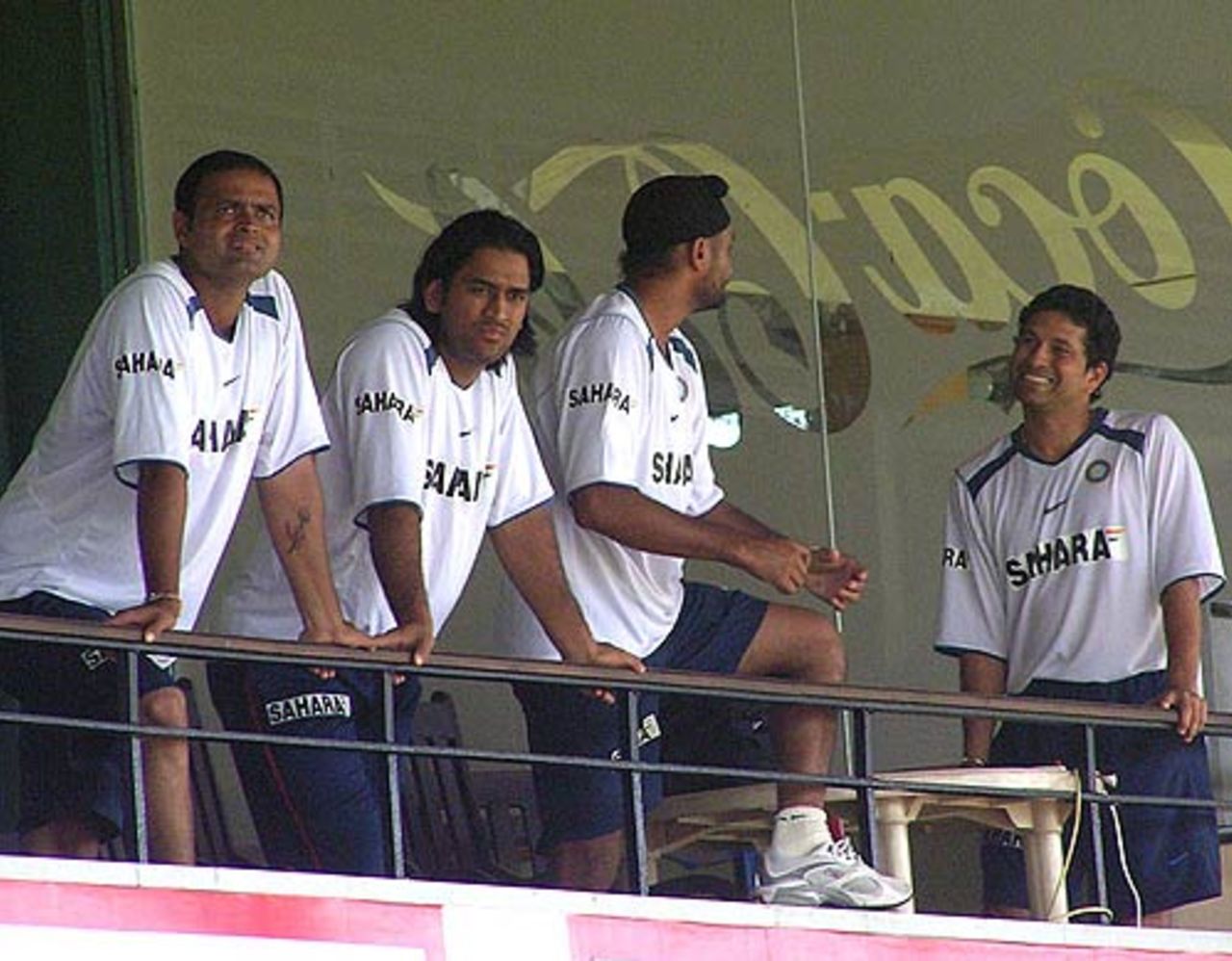 Sachin Tendulkar and Harbhajan Singh share a joke but the rest don't seem to see the funny side to it, Sri Lanka v India, 1st ODI, Colombo, August 19, 2006