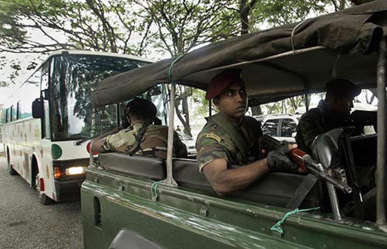 An armed pilot vehicle leads the Indian bus to practice, Colombo, August 17, 2006