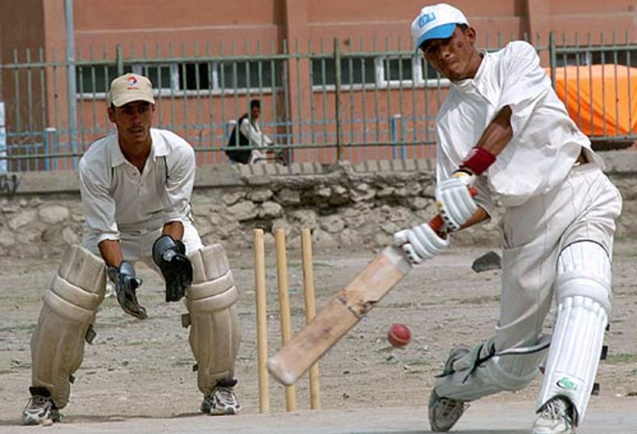 A cricket match in progress outside the national stadium in Kabul, August 23, 2006