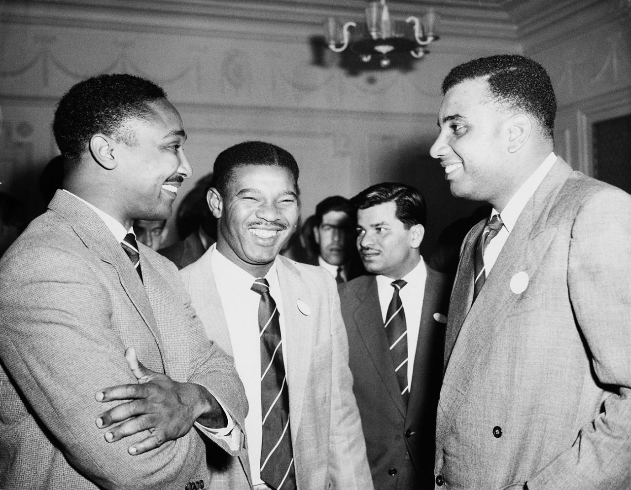 Frank Worrell, Everton Weekes and Clyde Walcott attend a party at the West Indian club in London, April 15, 1957