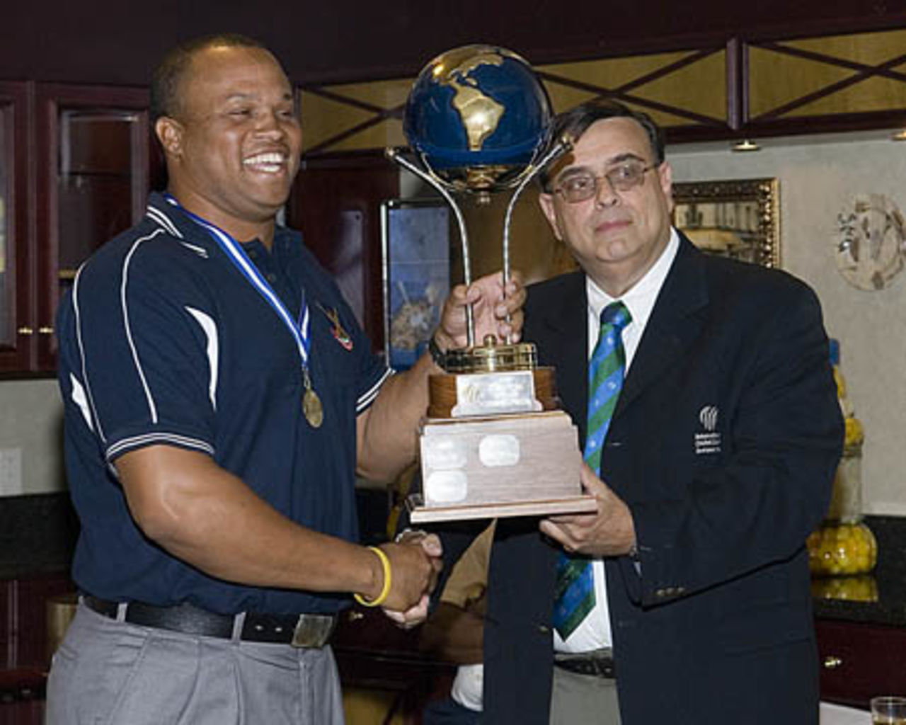 Irving Romaine Captain of Bermuda receiving Americas Trophy from Martin Vieira RDM ICC Americas, ICC World Cricket League Americas Region Division One, August 2006