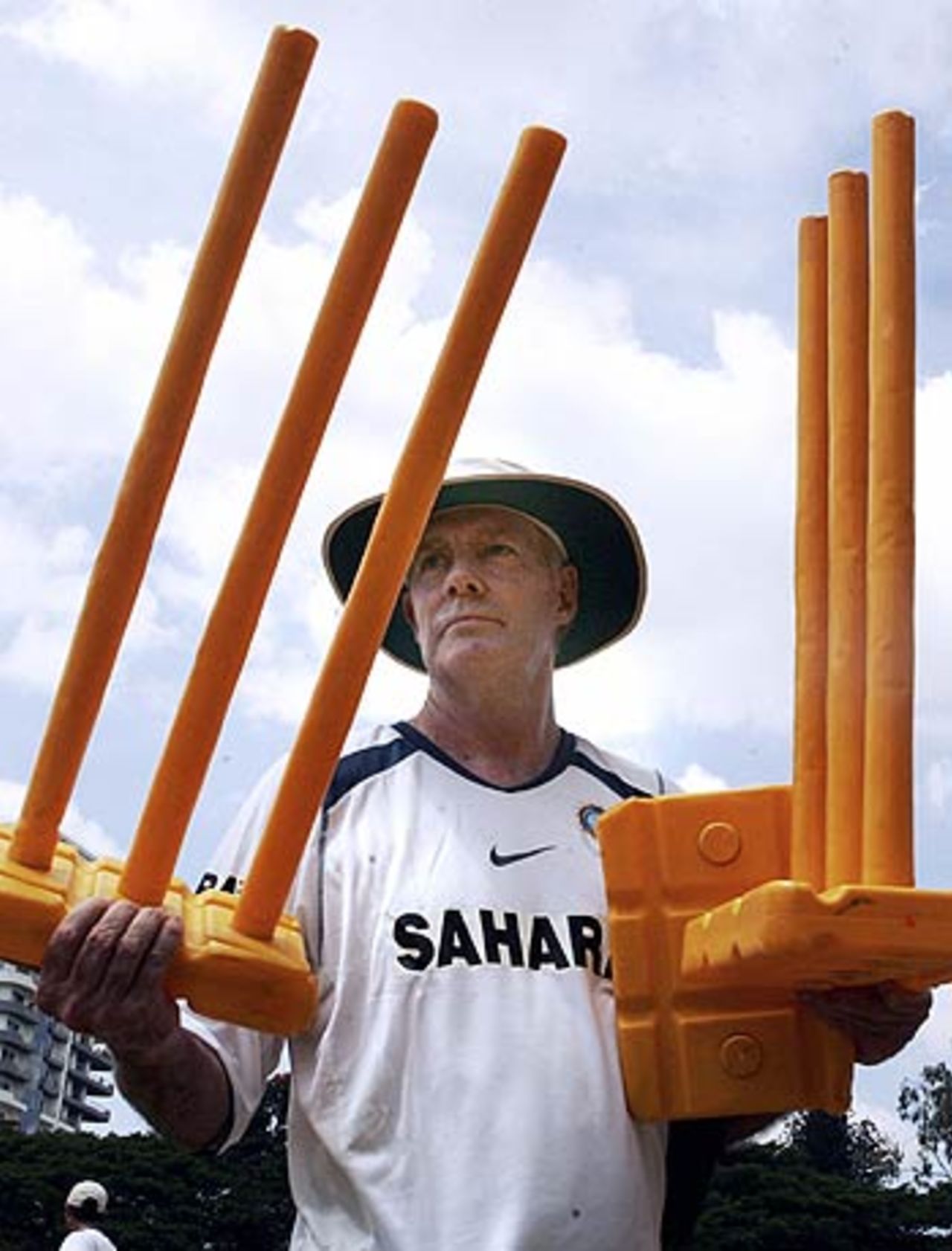Greg Chappell returns to the dressing room with the stumps after training, at the NCA in Bangalore, September 1, 2006