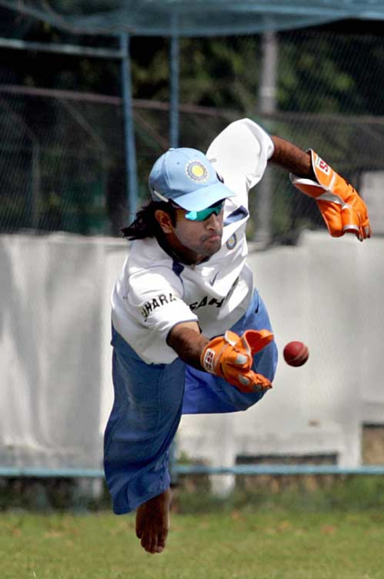 Mahendra Singh Dhoni dives for a catch in training during India's nine-day training camp, Banglaore, September 3, 2006