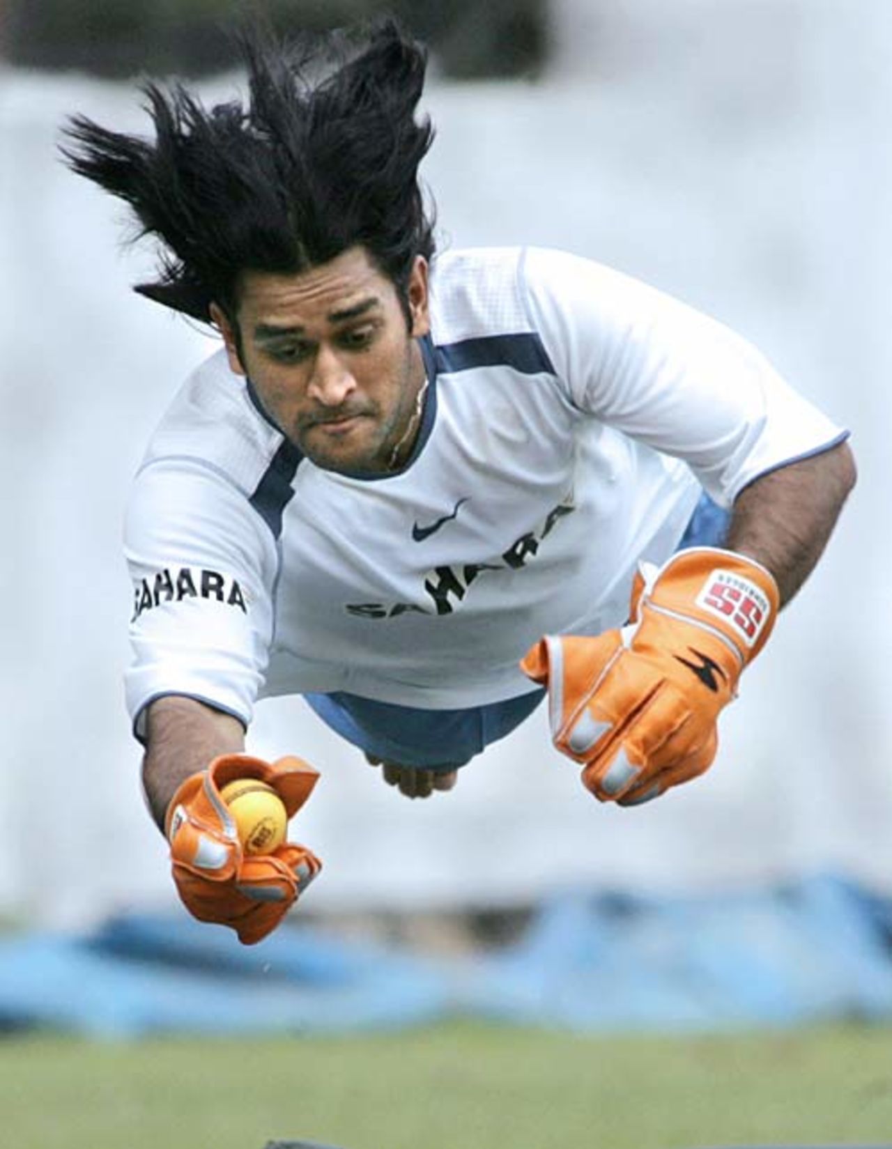 Mahendra Singh Dhoni makes an acrobatic save, Bangalore, September 4, 2006