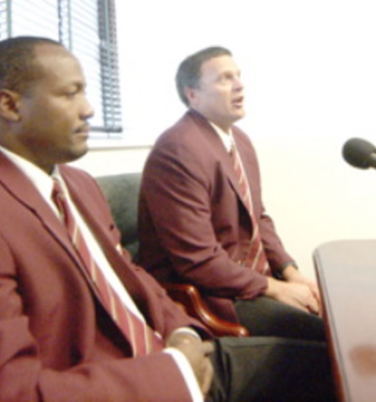 Brian Lara and Bennett King take questions from the press at the Grantley Adams Internatonal Airport on the way to the DLF Cup, Bridgetown, September 7, 2006 