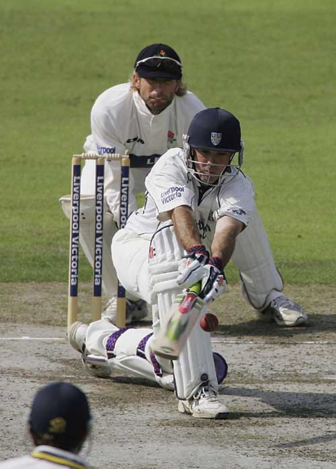 Jimmy Maher sweeps on the first morning at Old Trafford, Lancashire v Durham, County Championship, Old Trafford, September 13, 2006