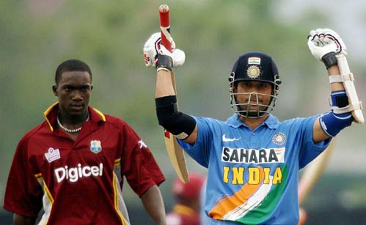 Sachin Tendulkar celebrates his hundred next to Jerome Taylor, India v West Indies, 2nd ODI, DLF Cup, Kuala Lumpur, September 14, 2006