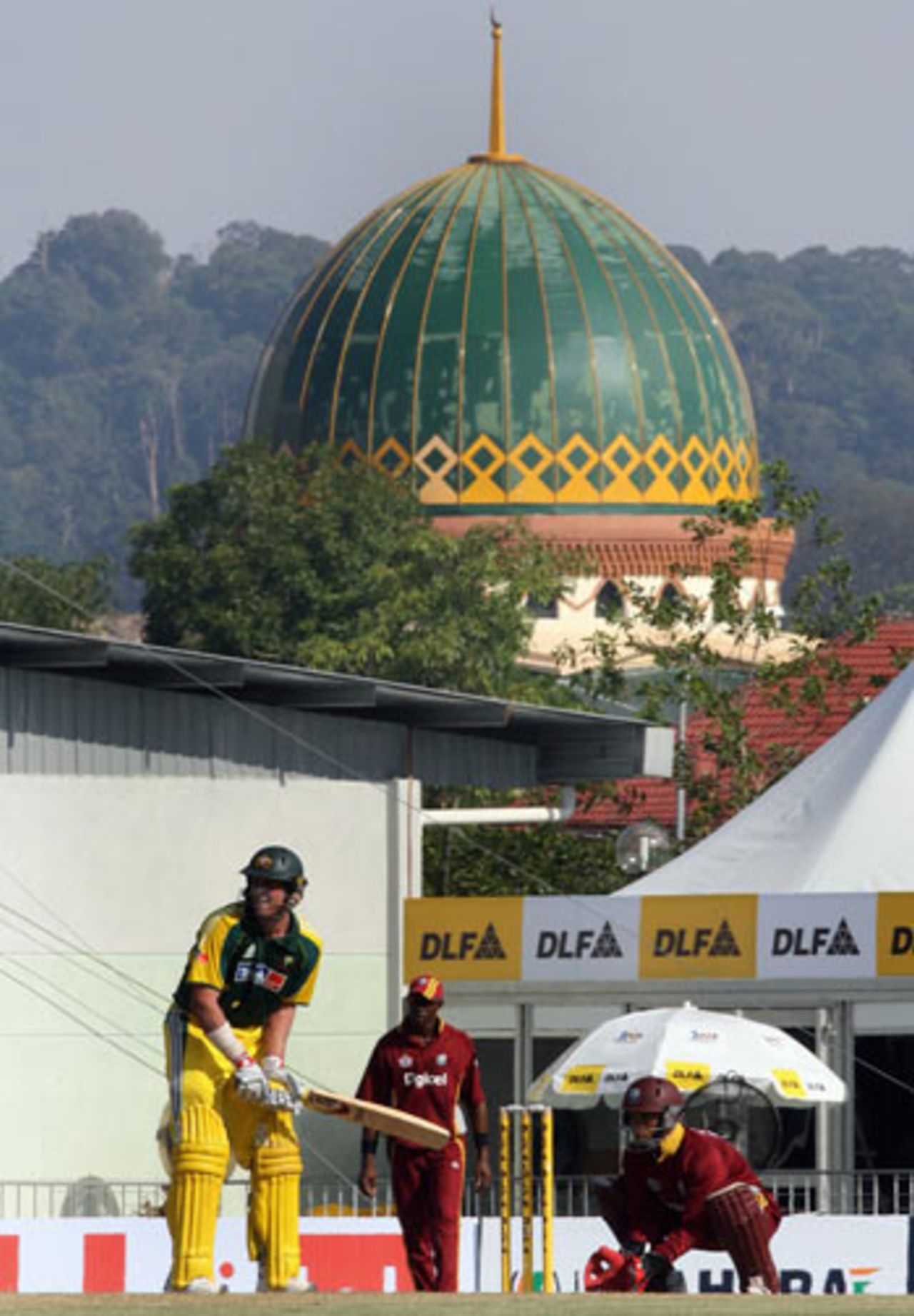 The mosque provides a picturesque backdrop as Michael Hussey takes guard, Australia v West Indies, DLF Cup, 4th match, September 18, 2006