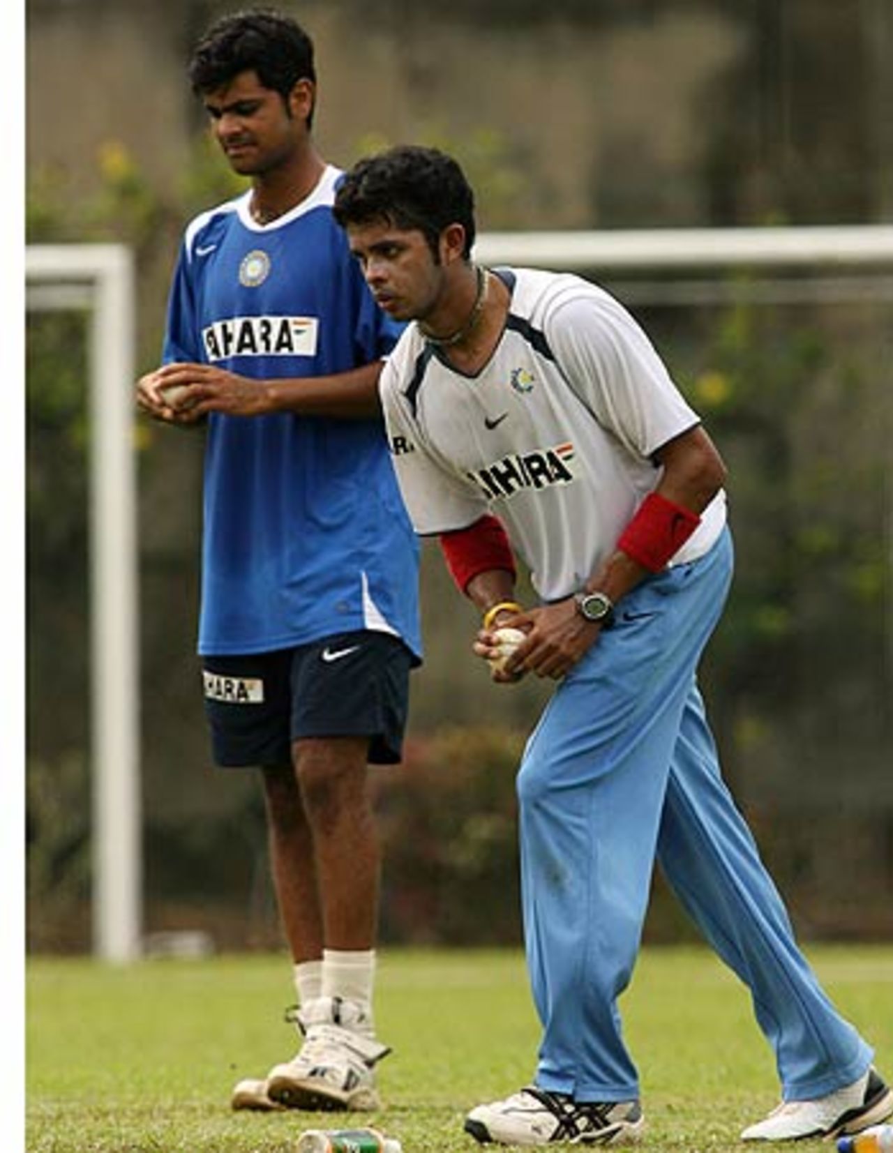 RP Singh looks on as Sreesanth begins his run-up in the nets, at the Kinrara Academy Oval, Kuala Lumpur, September 19, 2006