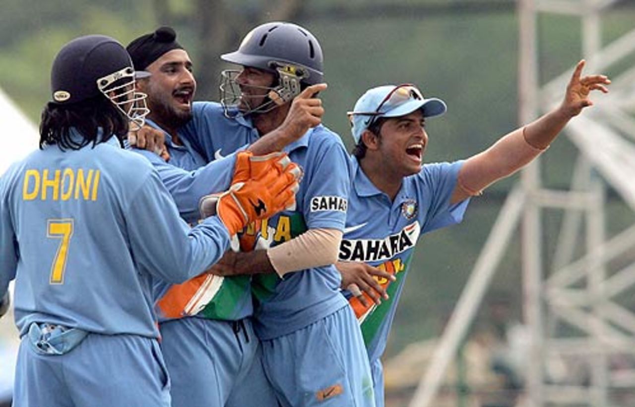 Harbhajan Singh is mobbed by his team-mates after getting rid of Michael Hussey, India v Australia, DLF Cup, 6th match, Kinrara Academy Oval, September 22, 2006