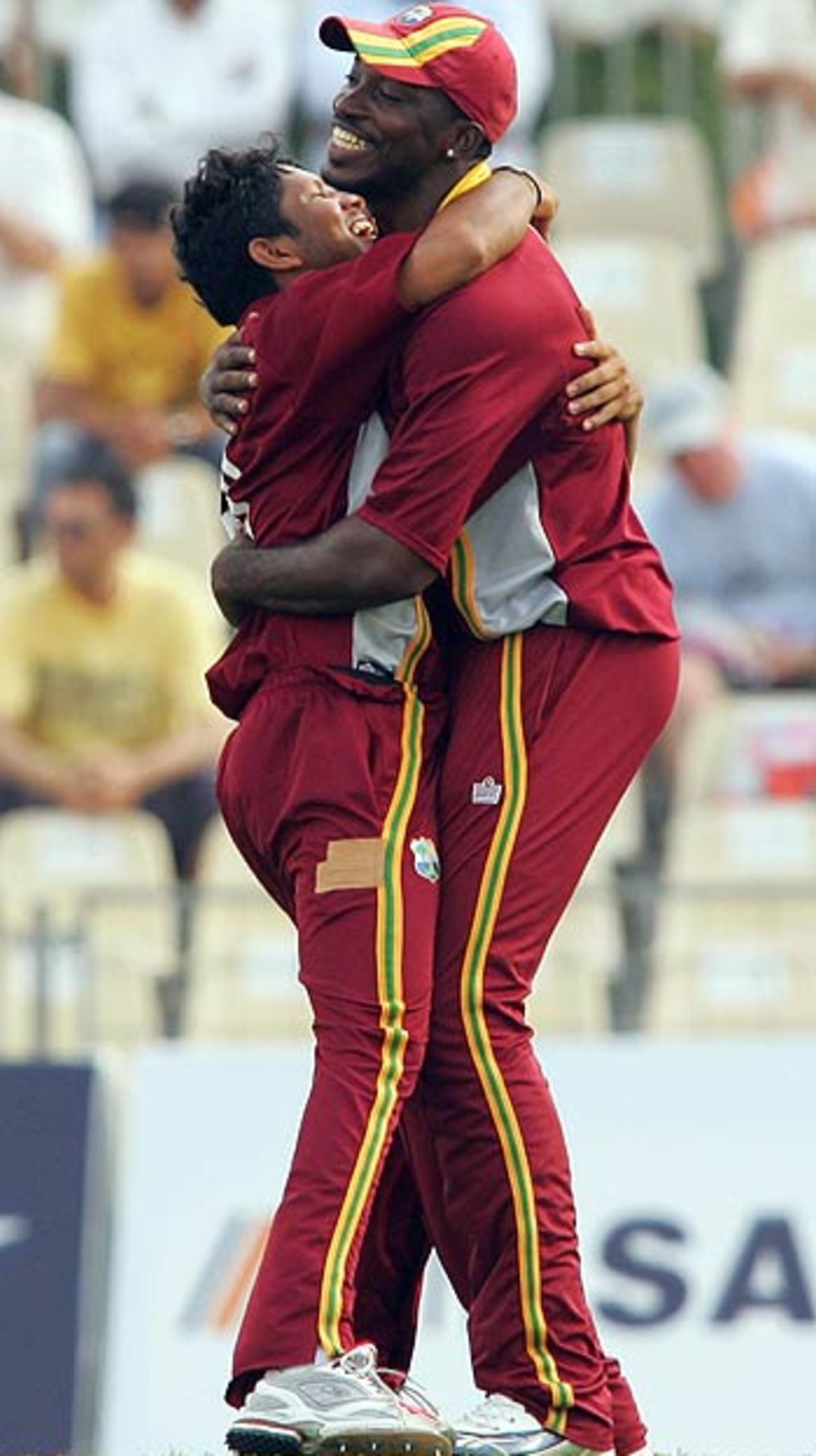 A delighted Ramnaresh Sarwan hugs Chris Gayle as West Indies grab their sixth wicket, Australia v West Indies, DLF Cup final, September 24, 2006