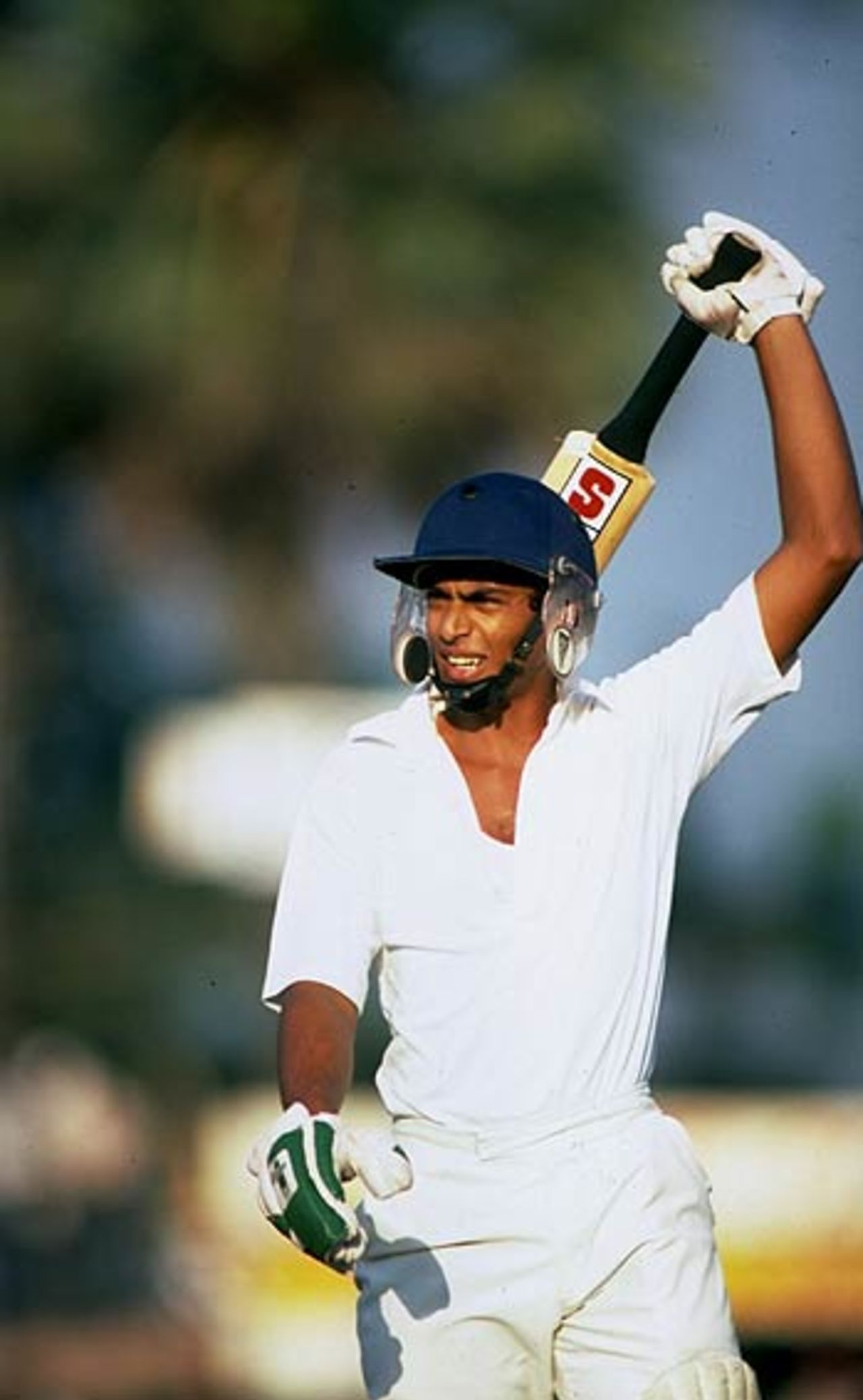 Ranjan Madugalle raises his bat in Sri Lanka's first Test match against England, at Colombo, February 21, 1982